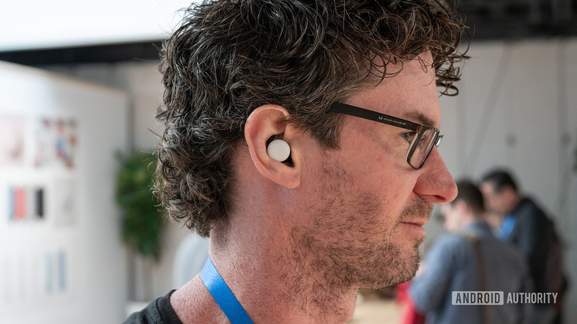 Google Pixel Buds worn by a man at the Made By Google Event 2019.