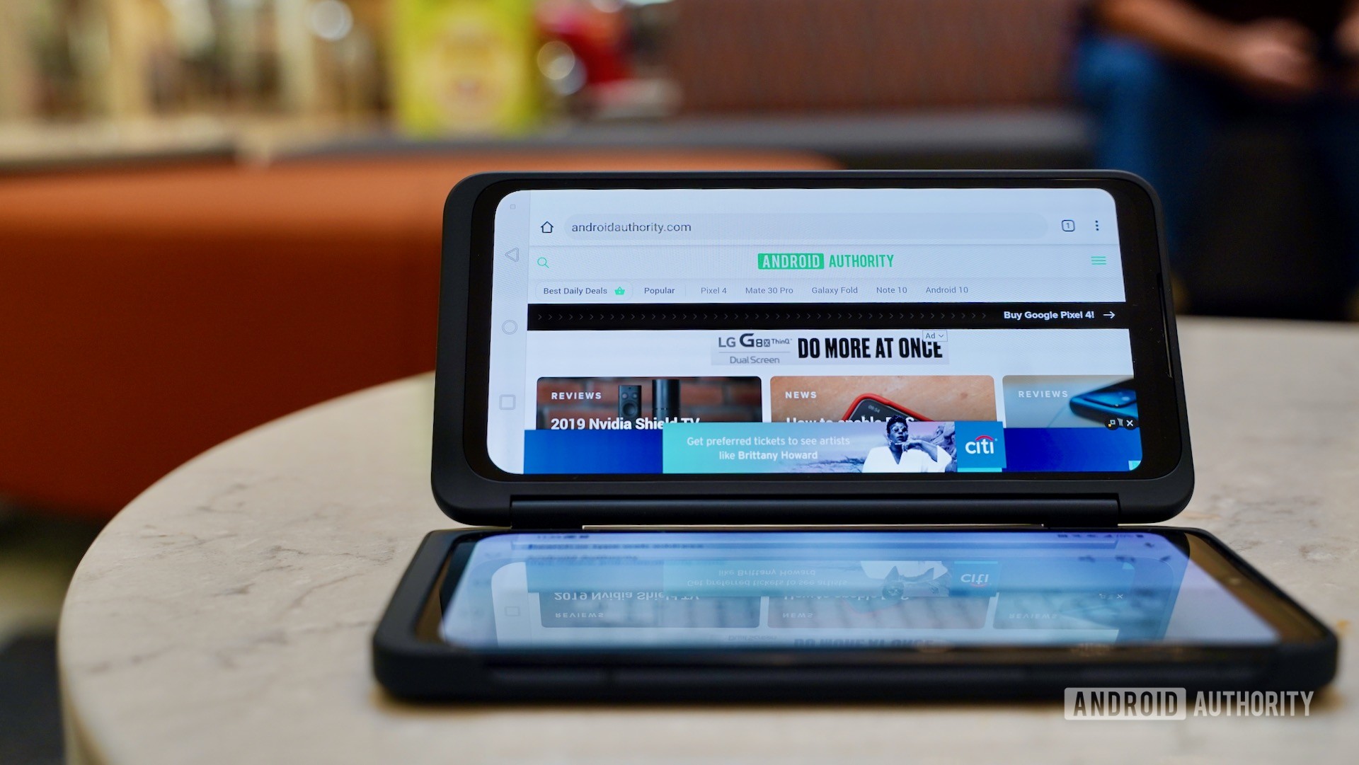 LG G8X ThinQ Review laptop on ottoman