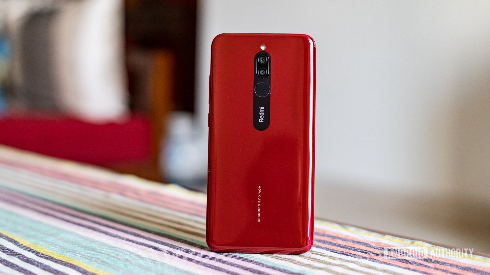 Redmi 8 standing up showing camera and back