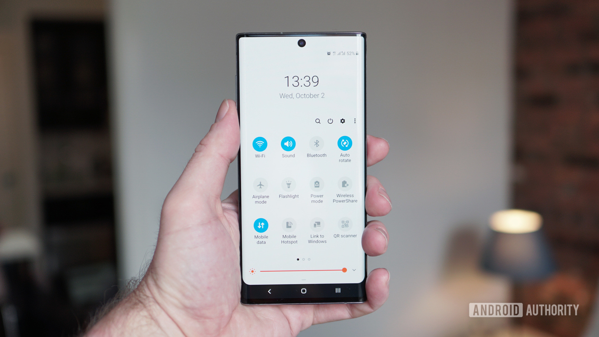 Samsung Galaxy Note 10 quick settings menu in hand