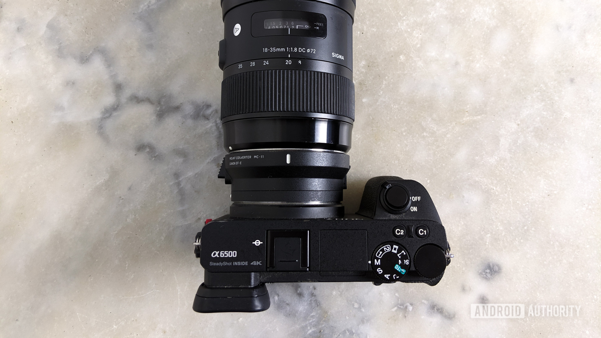 Top-down shot of the Sony a6500 mirrorless camera with a Sigma lens attached