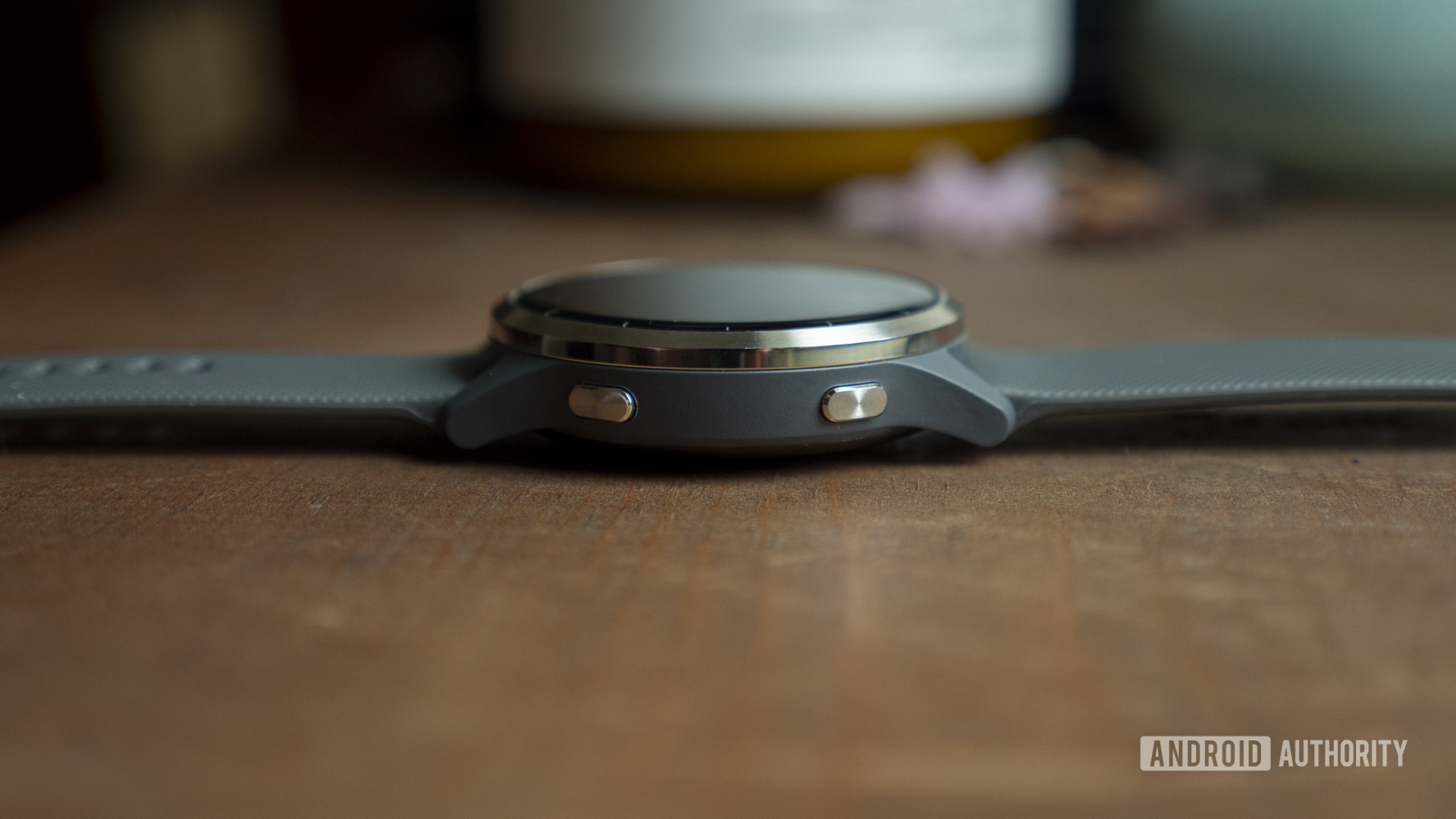 A Garmin vivoactive 4 review rests face up with its buttons highlighted.