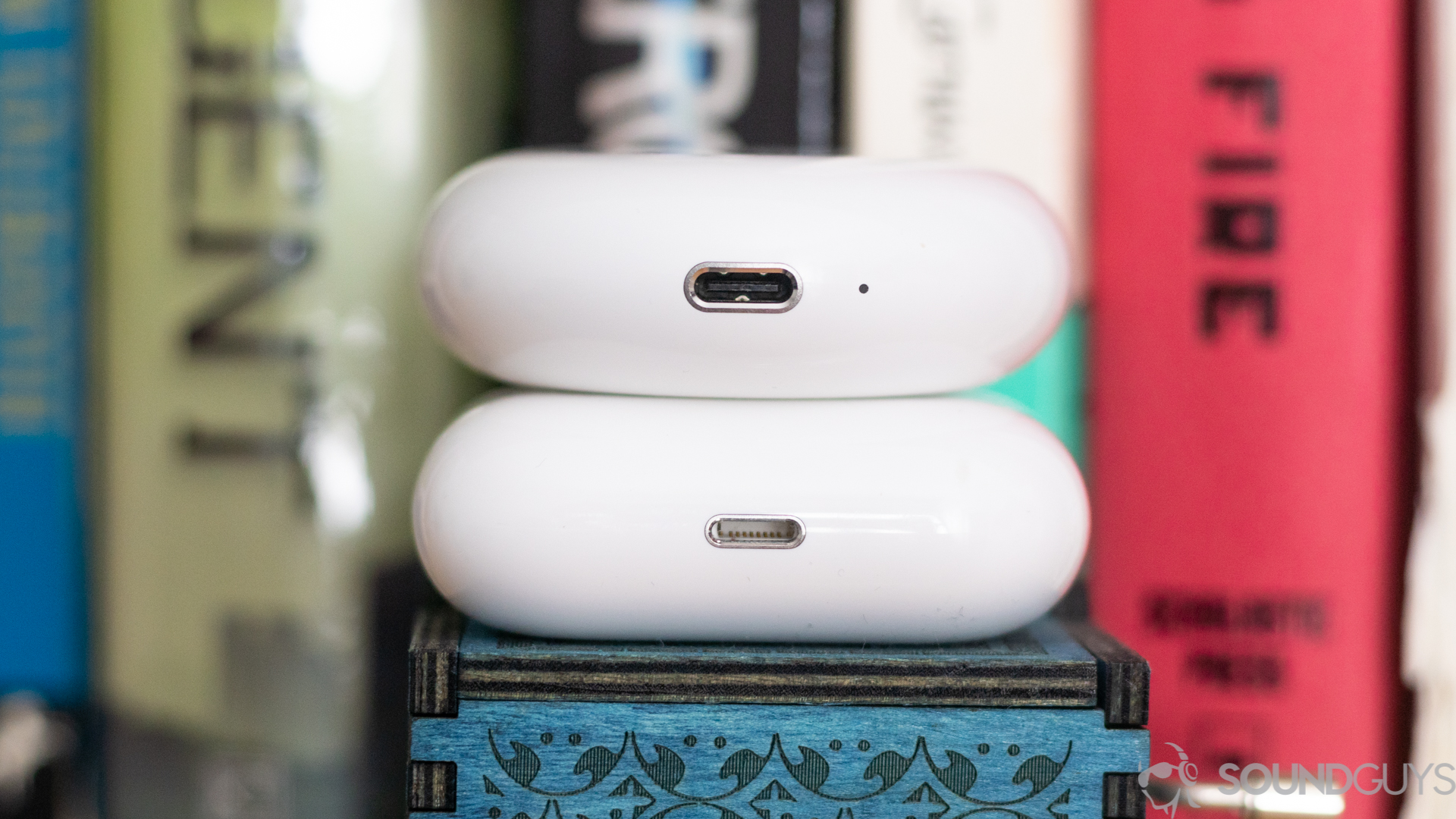 Close-up shot of the USB-C and Lightning inputs on the charging cases of the Huawei Freebuds 3 and Apple AirPods Pro
