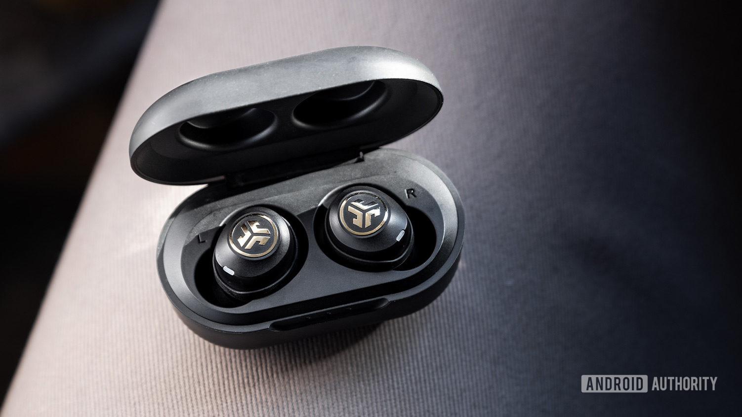 An aerial picture of the JLab  JBuds Air Icon true wireless earbuds in the charging case.