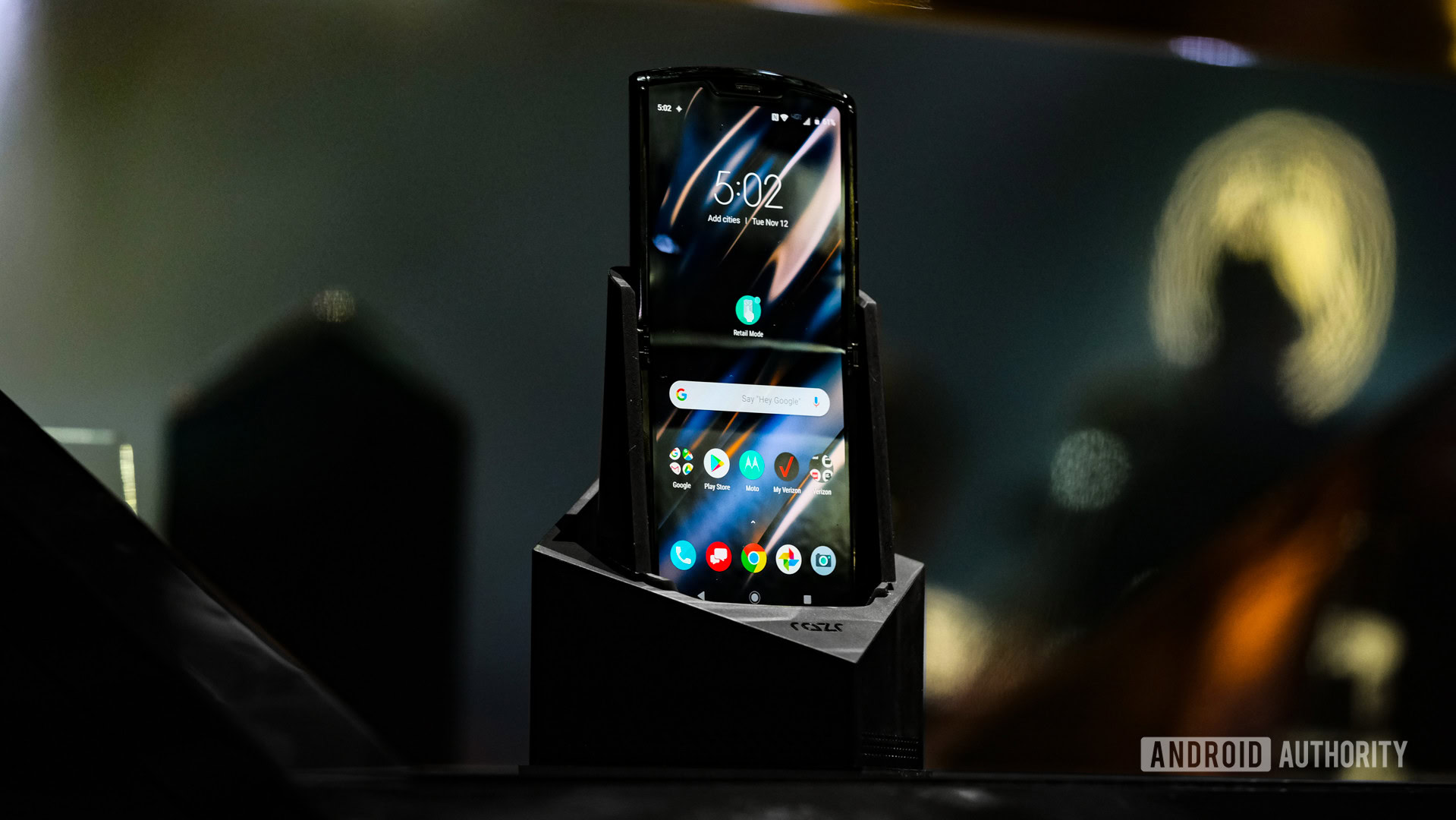 Moto Razr foldable unfolded sitting in box speaker