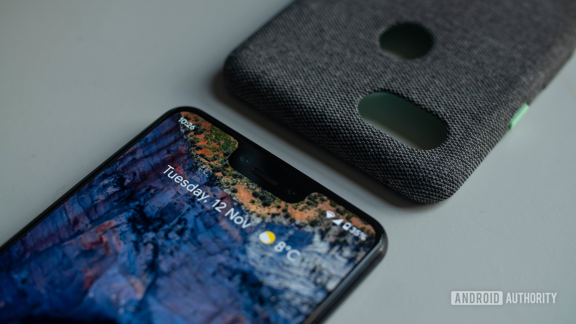 Pixel 3 XL product photo flat lay on home screen with case