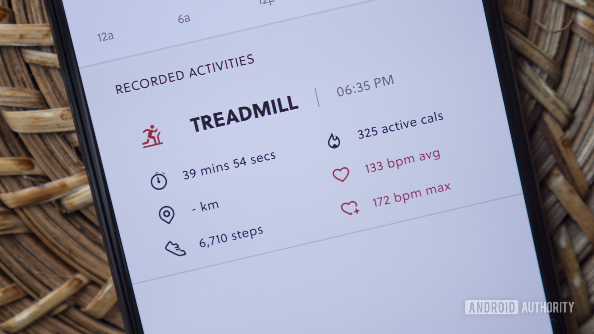 A smartphone paired to a Fossil Hybrid HR displays a user's treadmill workout in the Fossil Hybrid Smartwatches app.