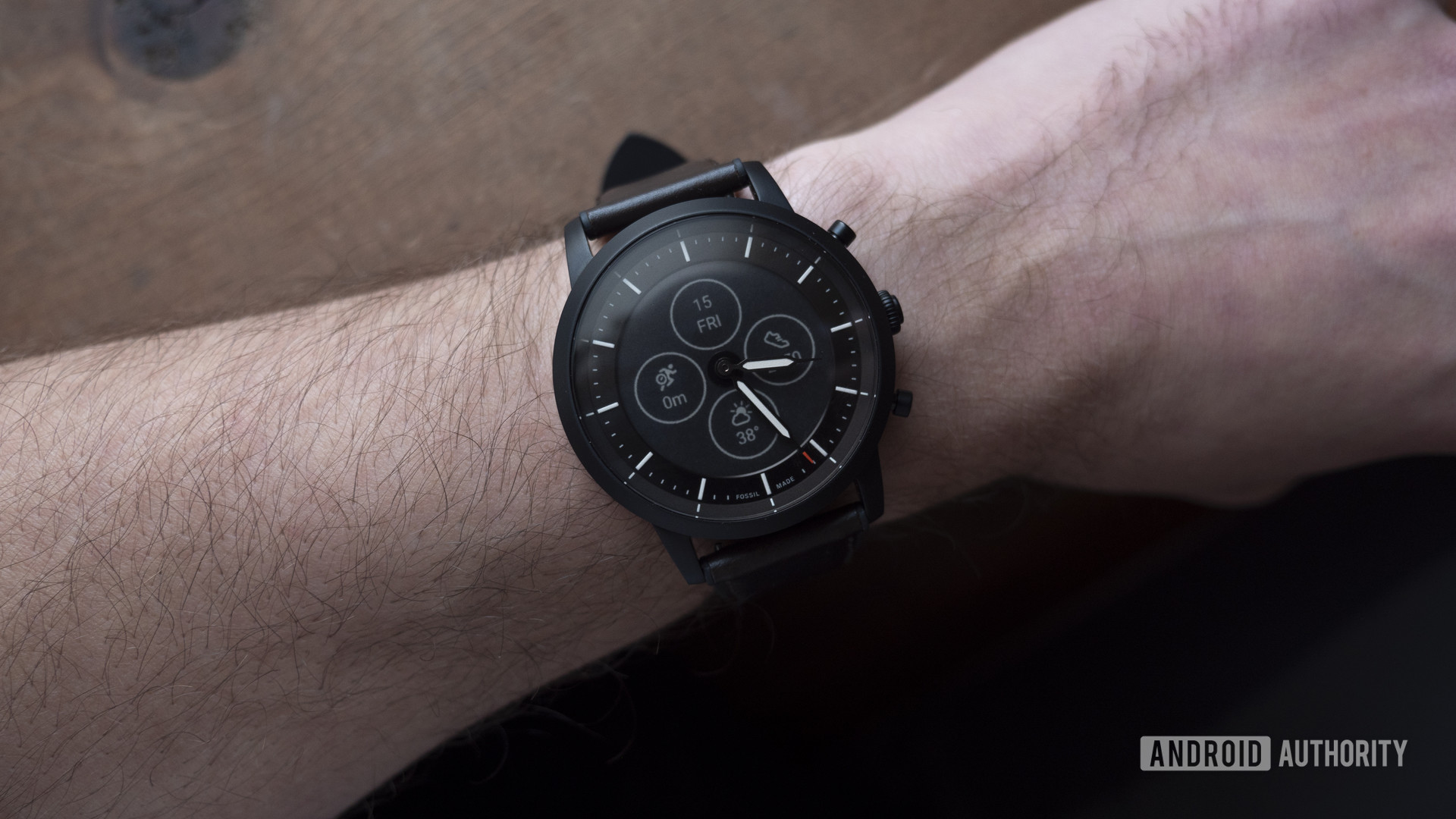 A Fossil Hybrid HR on a user's wrist highlights one of the company's most popular hybrid options. 