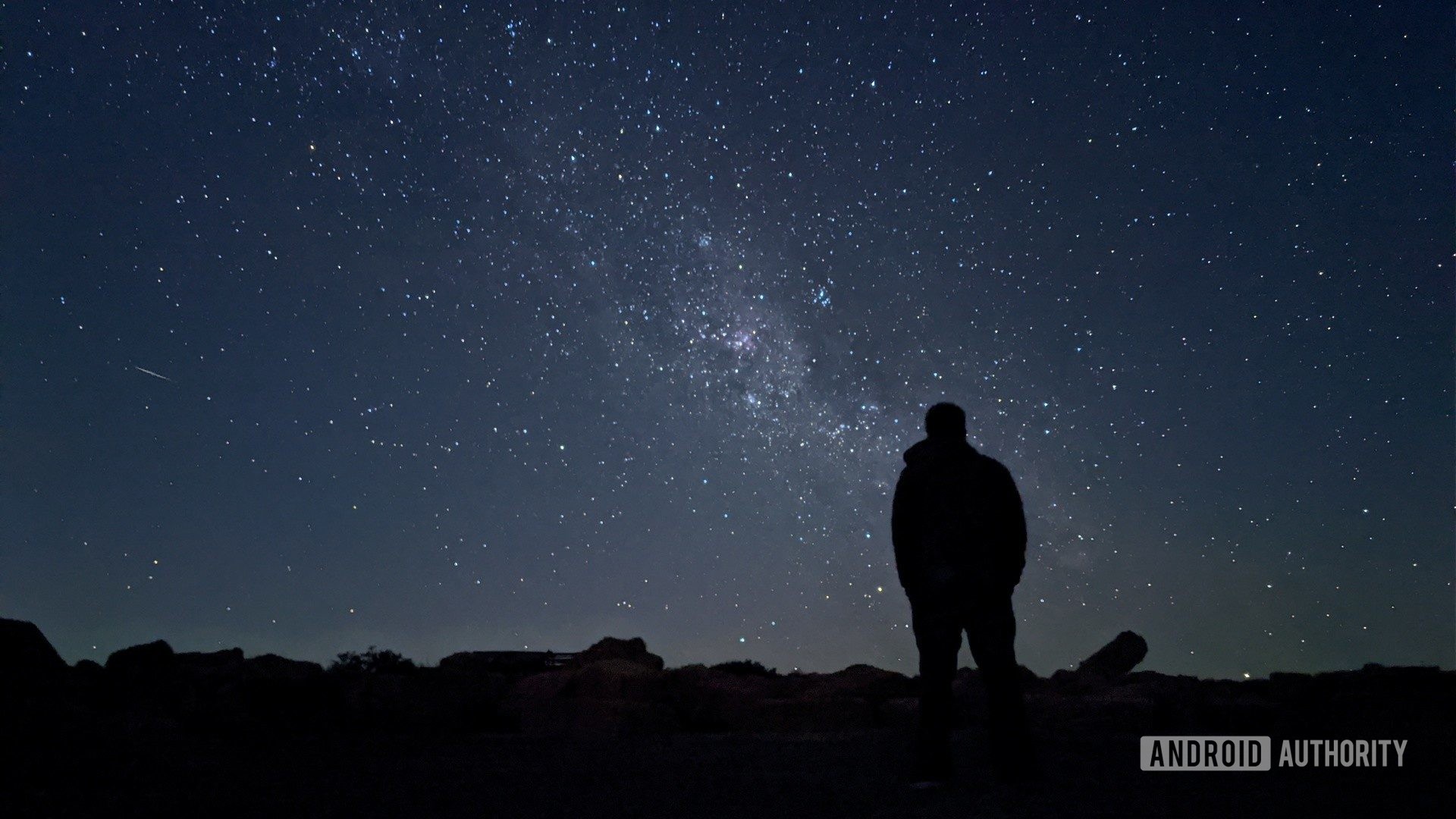 Pixel 4 astrophotography mode in Sutherland showing a man silhouetted against the night sky with stars.