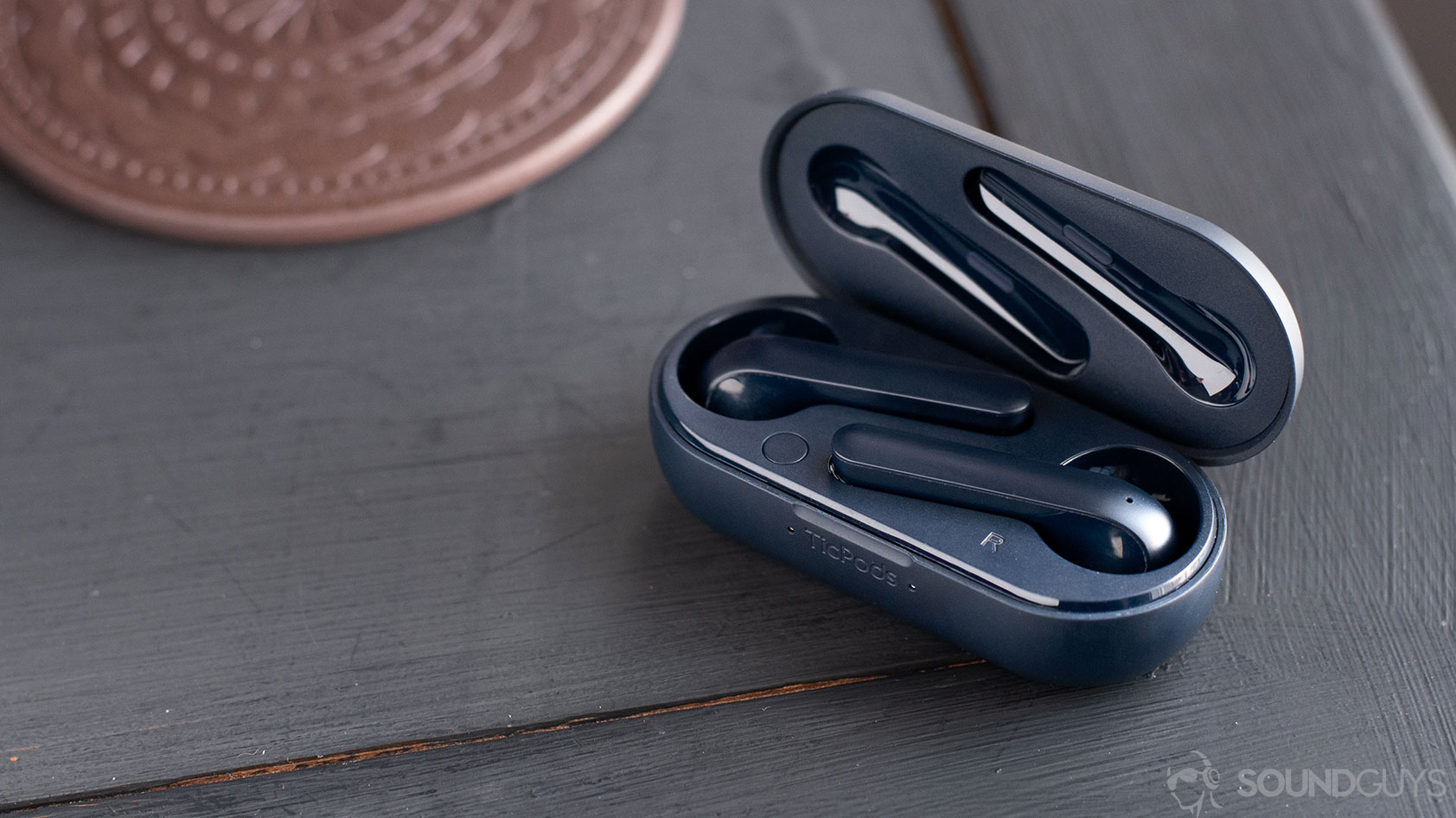 The Mobvoi TicPods 2 Pro true wireless earbuds in the charging case, both of which are navy.
