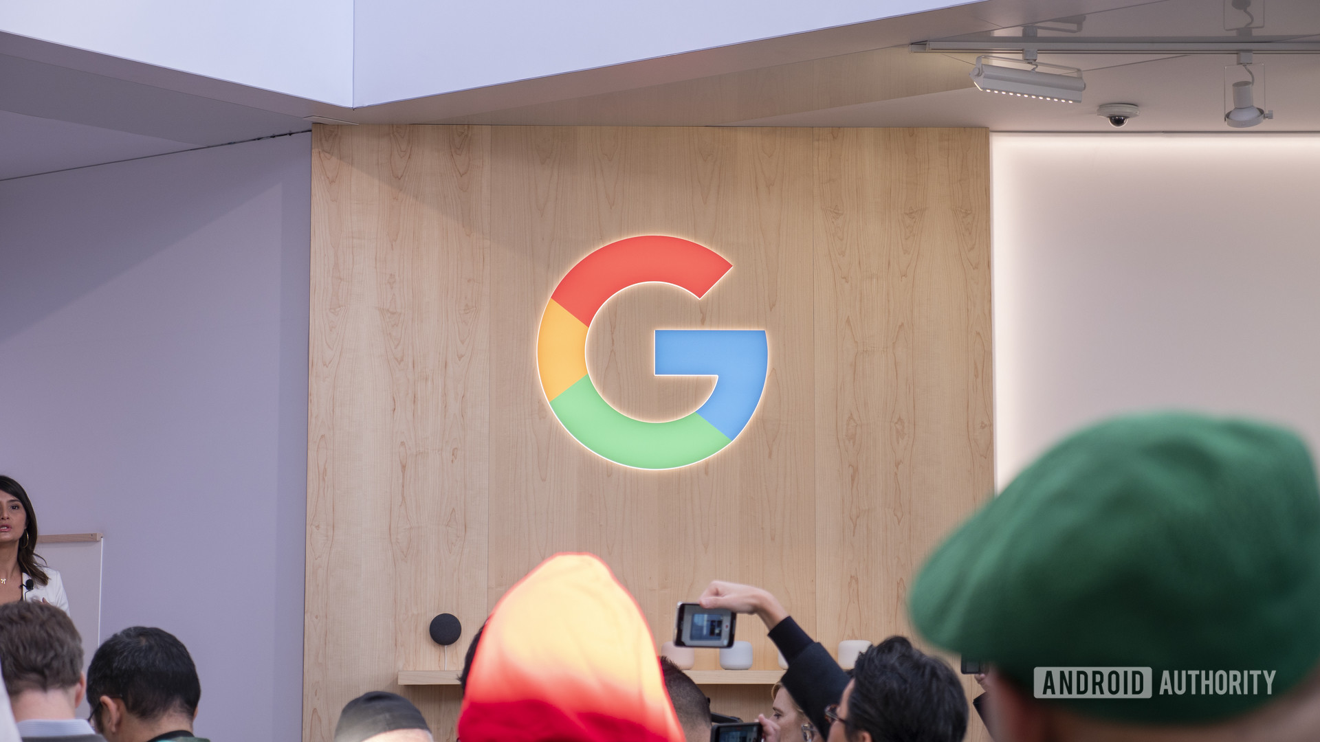A Google Logo stands out on a wall during CES 2020.