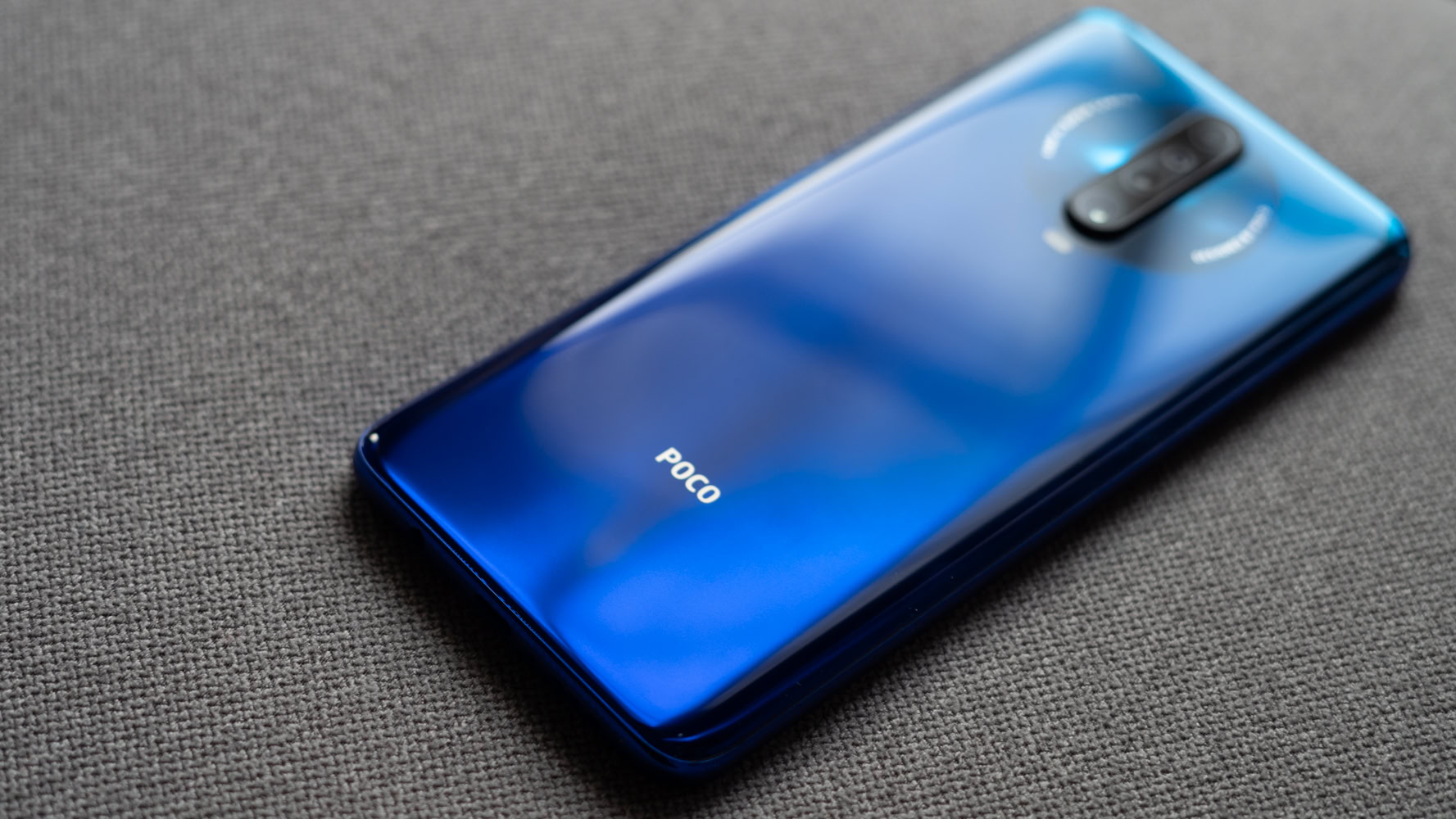 POCO X2 and logo in focus