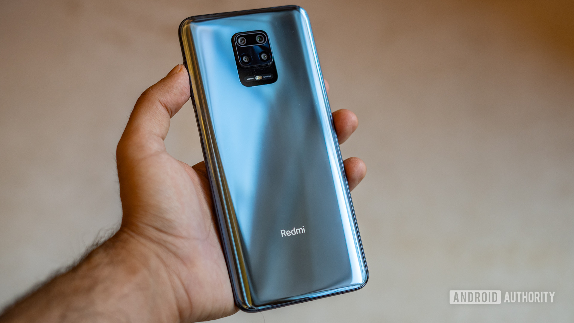 Redmi Note 9 Pro showing back in hand