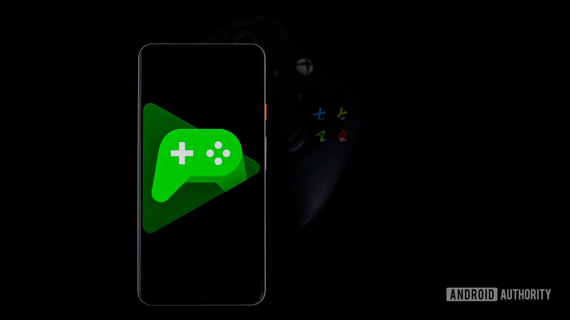 Google Play Games on smartphone next to controller2
