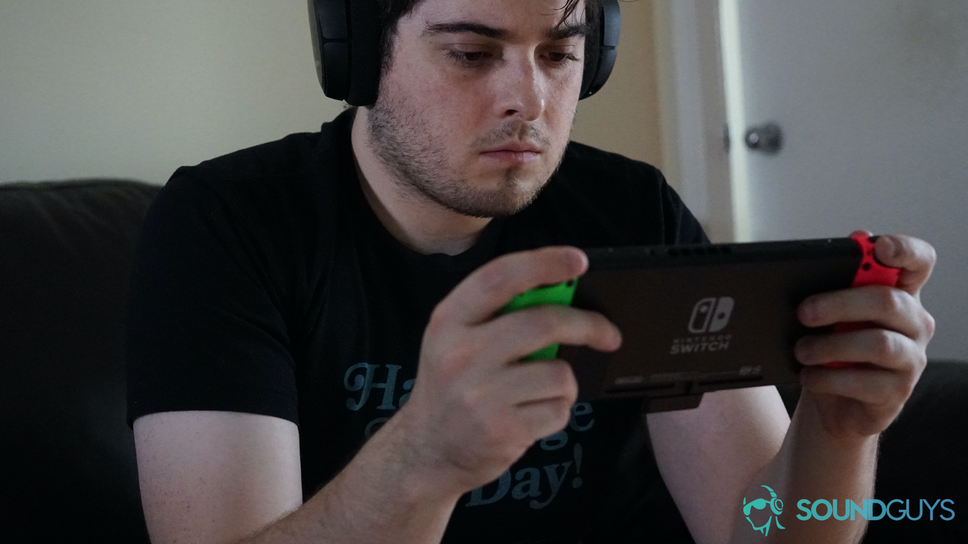A picture of the SteelSeries Arctis 1 Wireless being used by a man playing on a Nintendo Switch.
