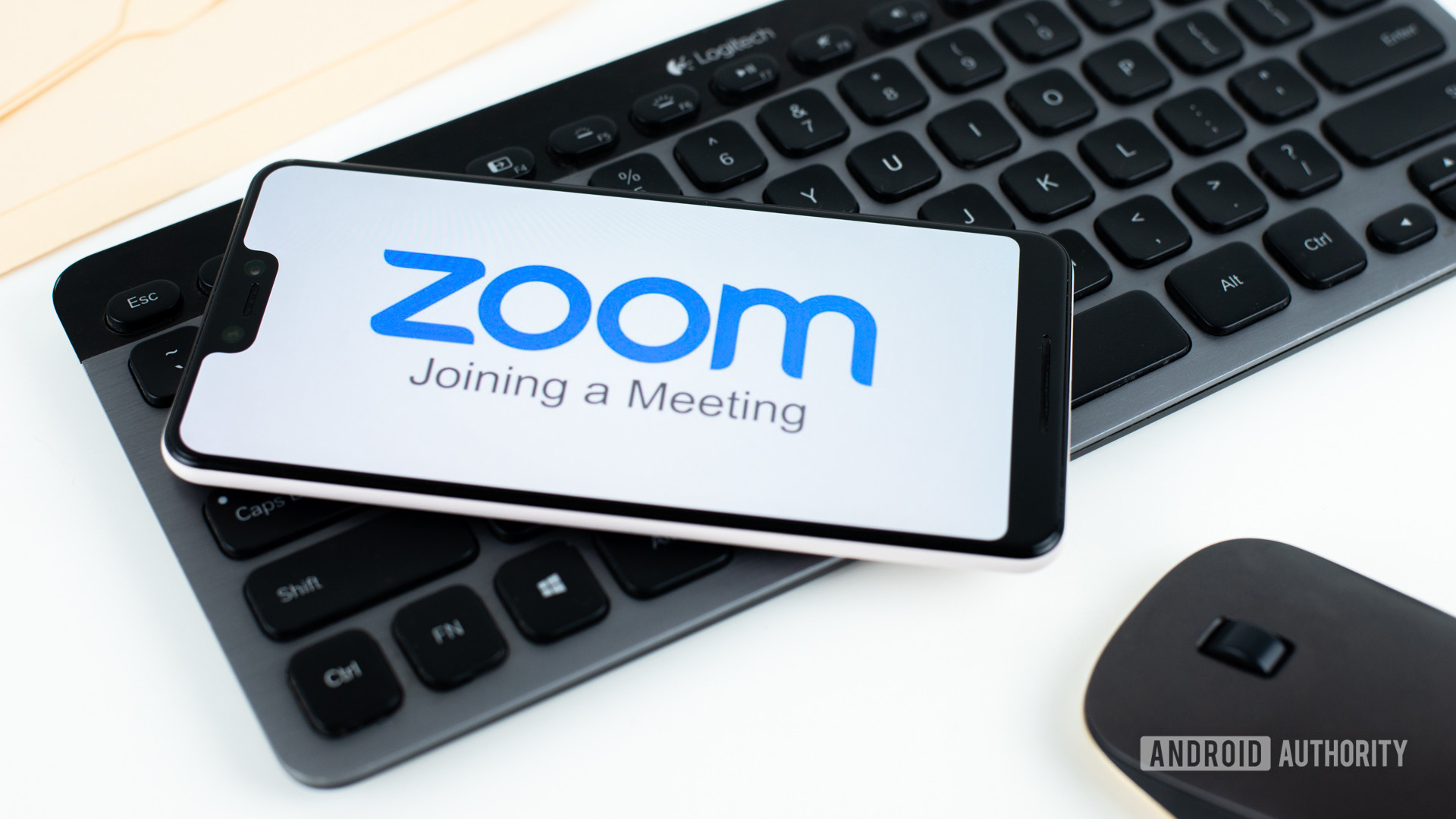 Zoom Meetings on smartphone next to office equipment stock 4