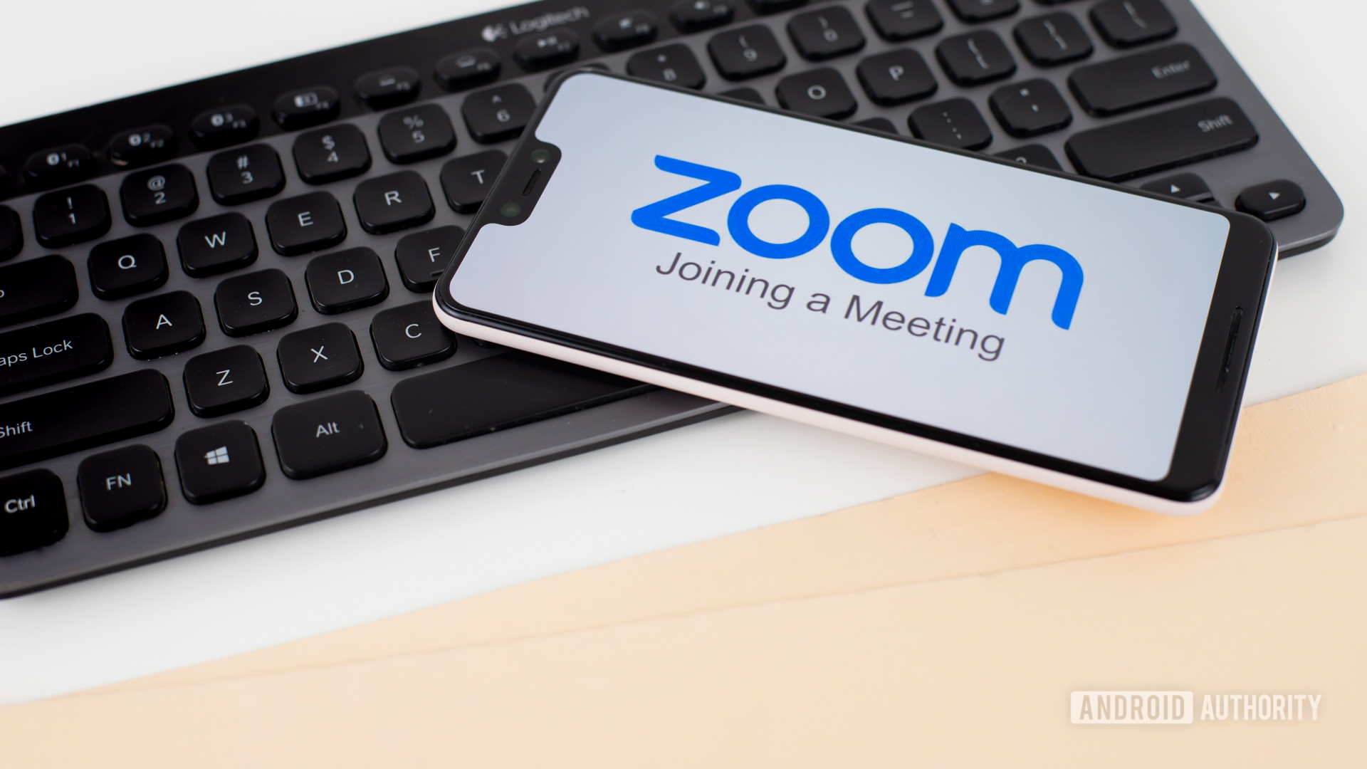 Zoom Meetings on smartphone next to office equipment stock 5