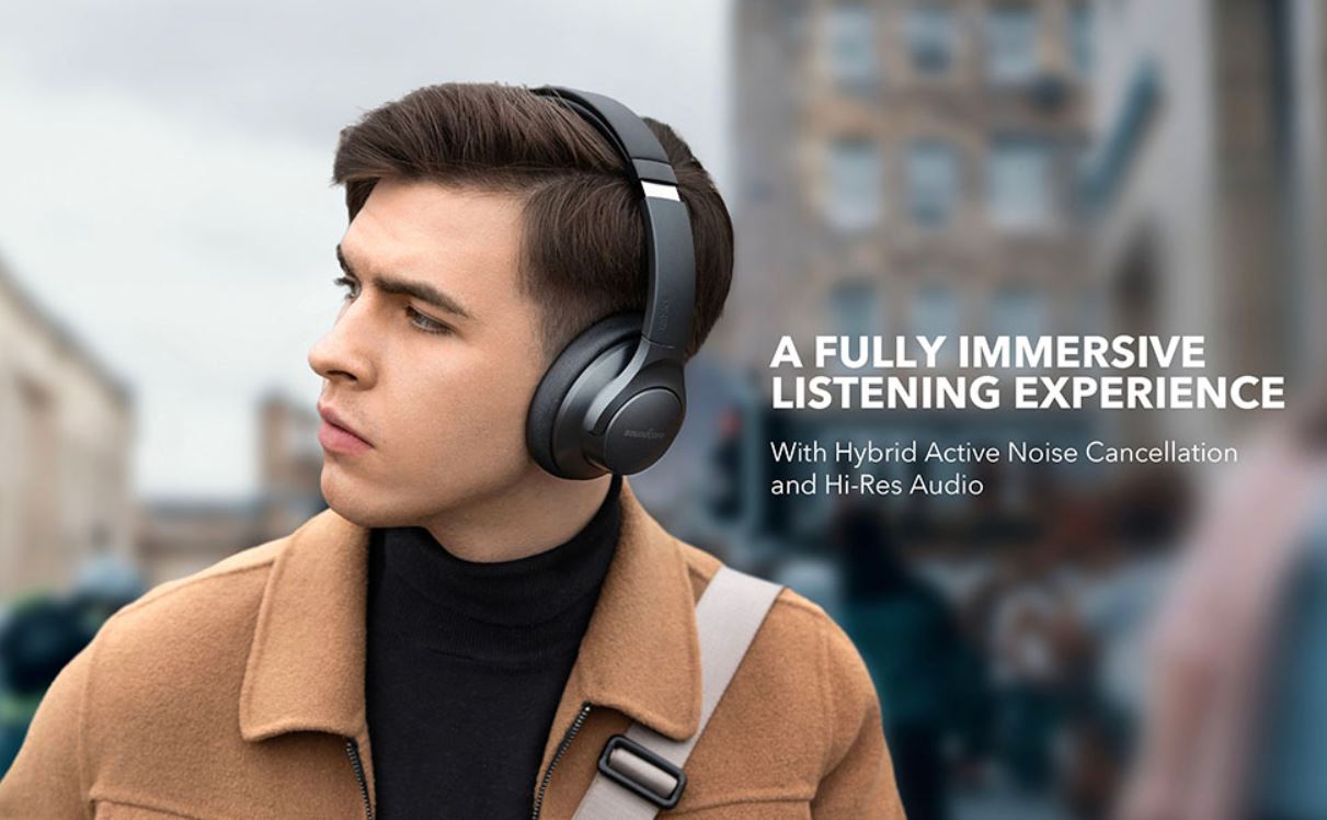 A man wears the Anker Soundcore Life Q20 cheap noise cancelling Bluetooth headphones.