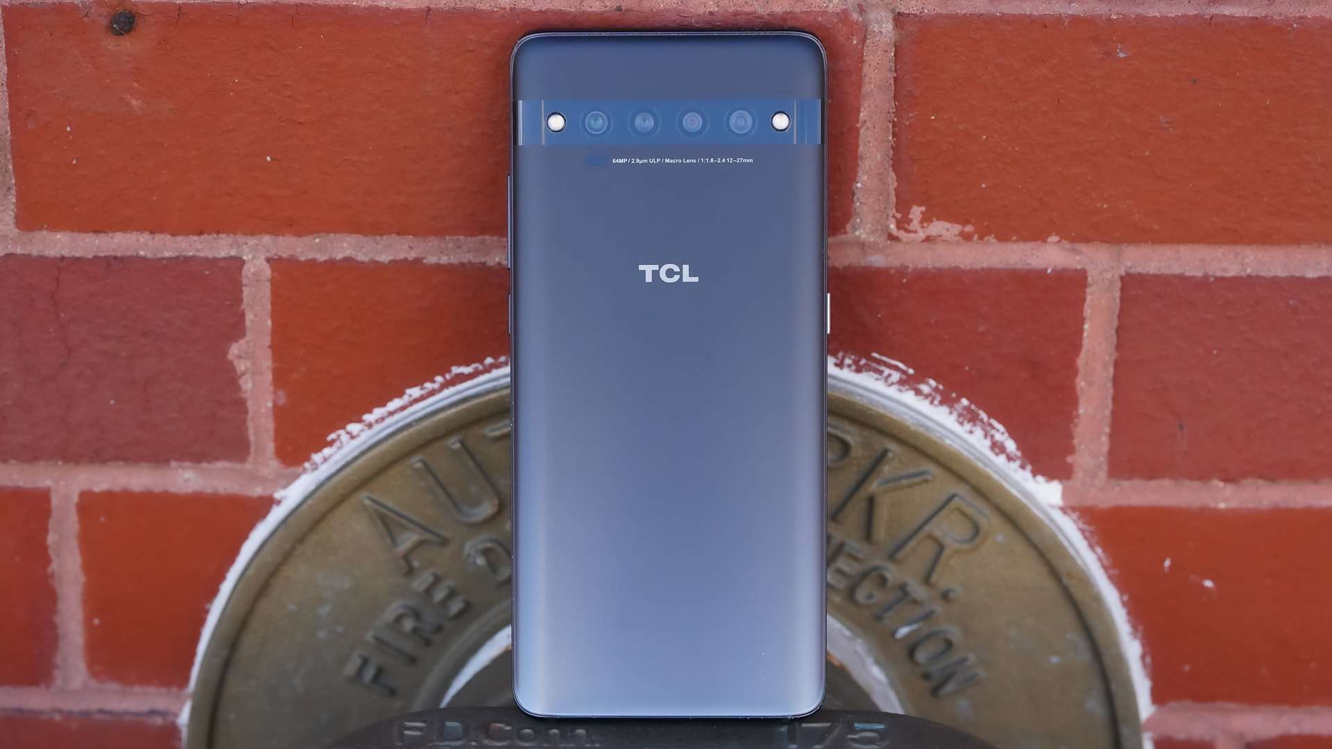 TCL 10 Pro rear against brick