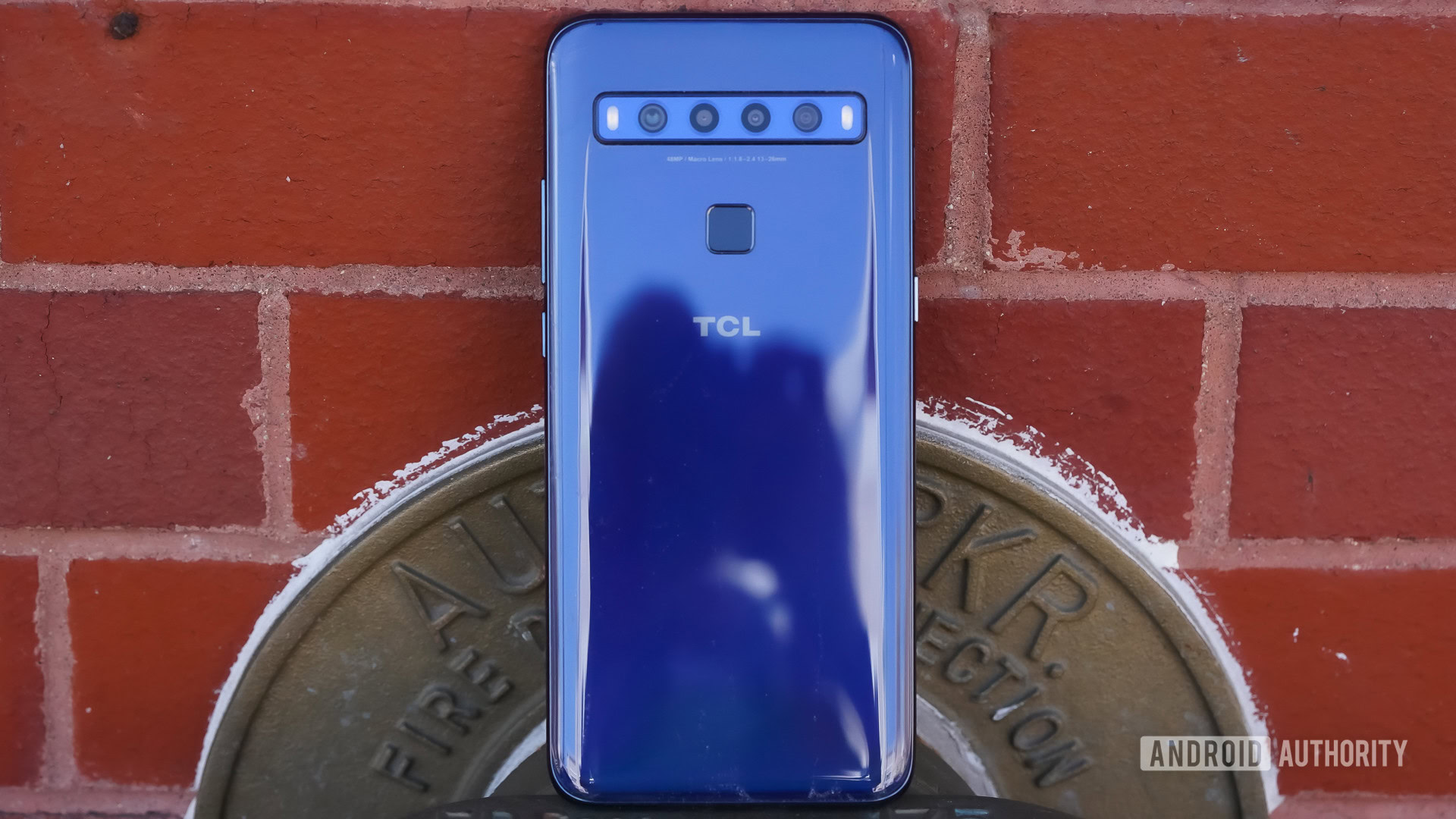 TCL 10L rear against brick