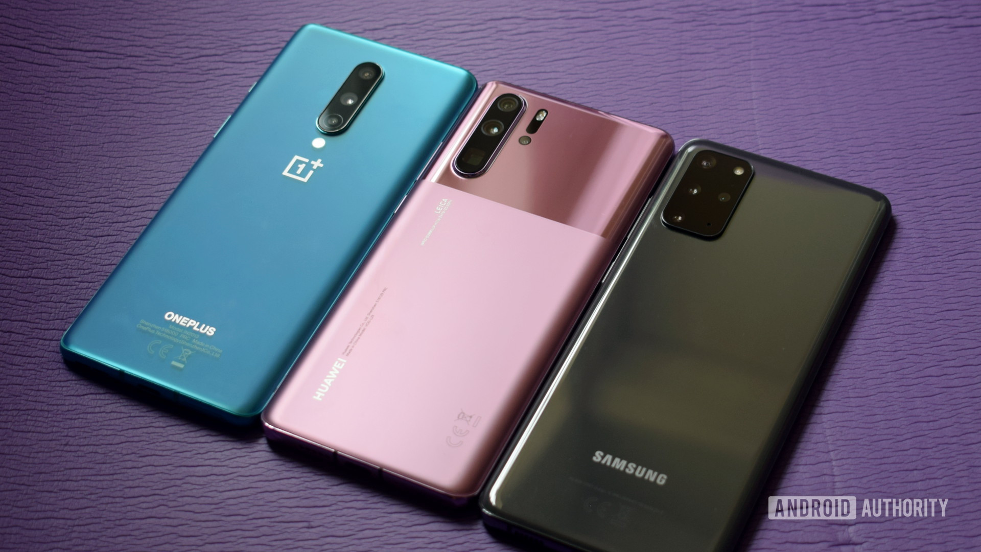 A picture of the HUAWEI P30 Pro vs Samsung Galaxy S20 vs OnePlus 8 against a lavender background.