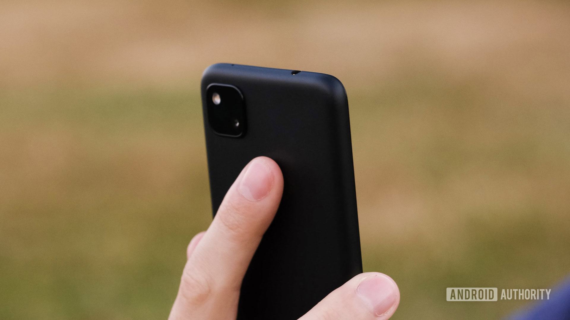 Google Pixel 4a pressing fingerprint reader