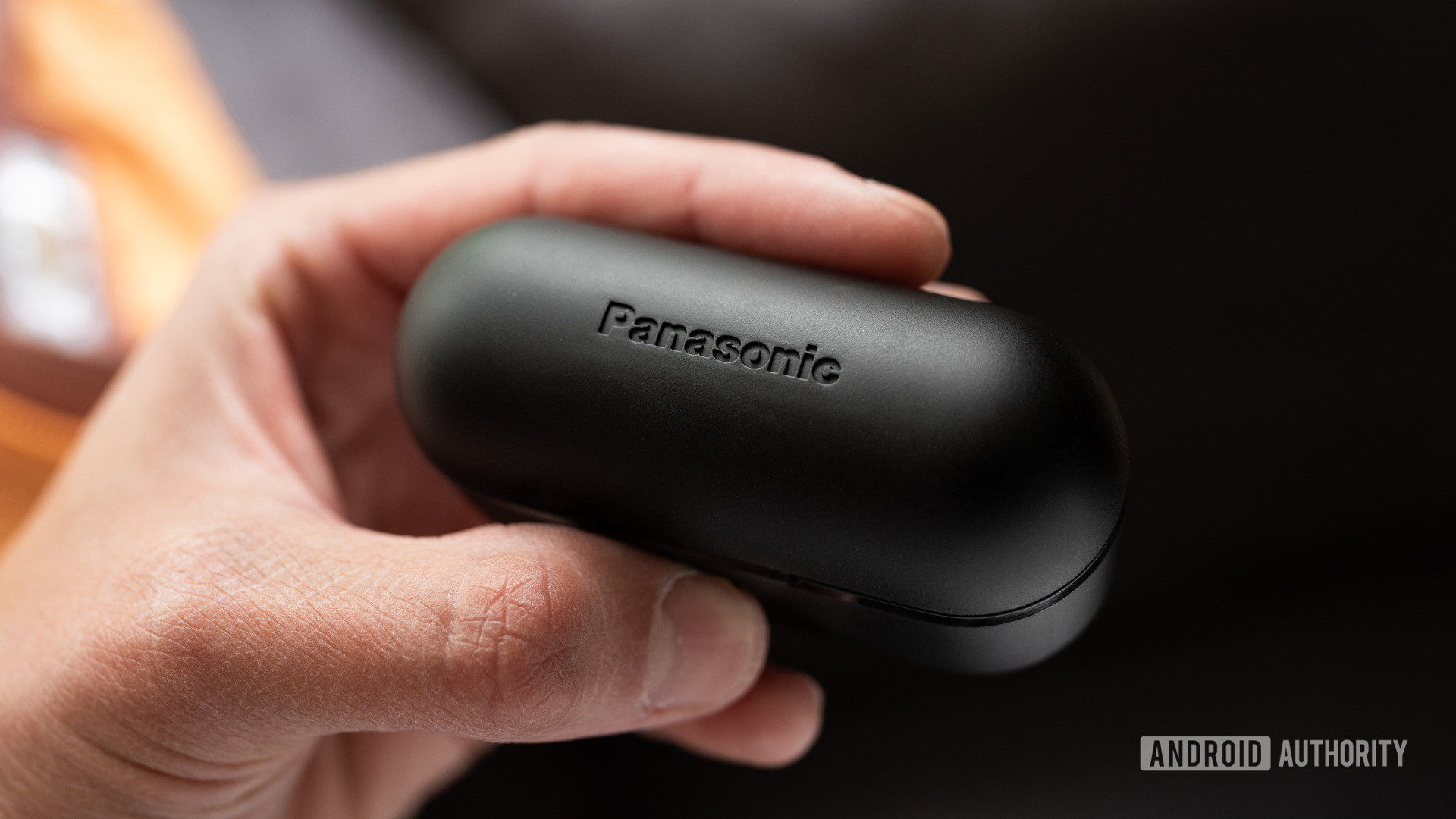 A picture of the Panasonic RZ-S500W noise cancelling earbuds case shut with the Panasonic logo in view.