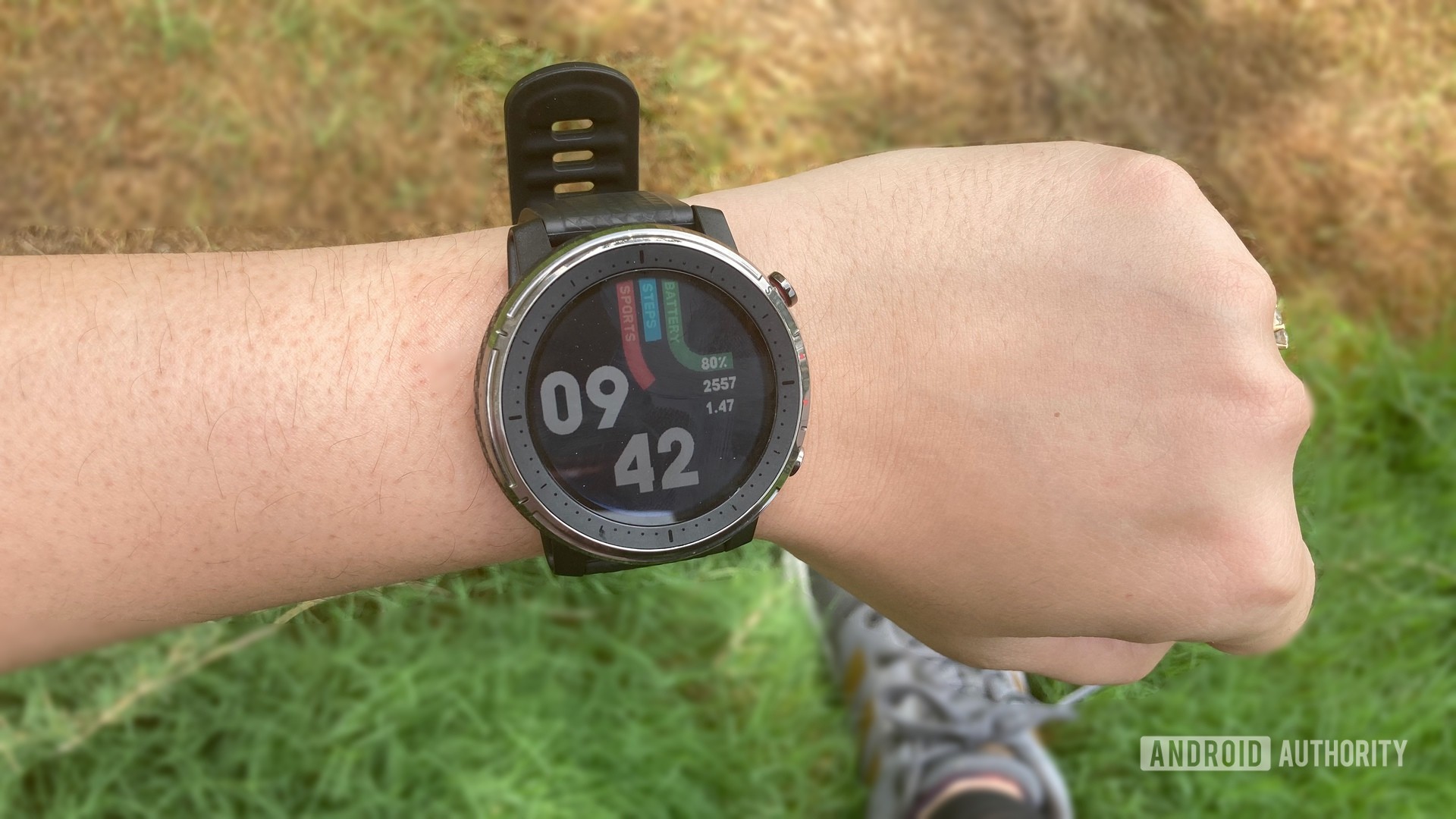Amazfit Stratos 3 strapped on a wrist showing default watchface