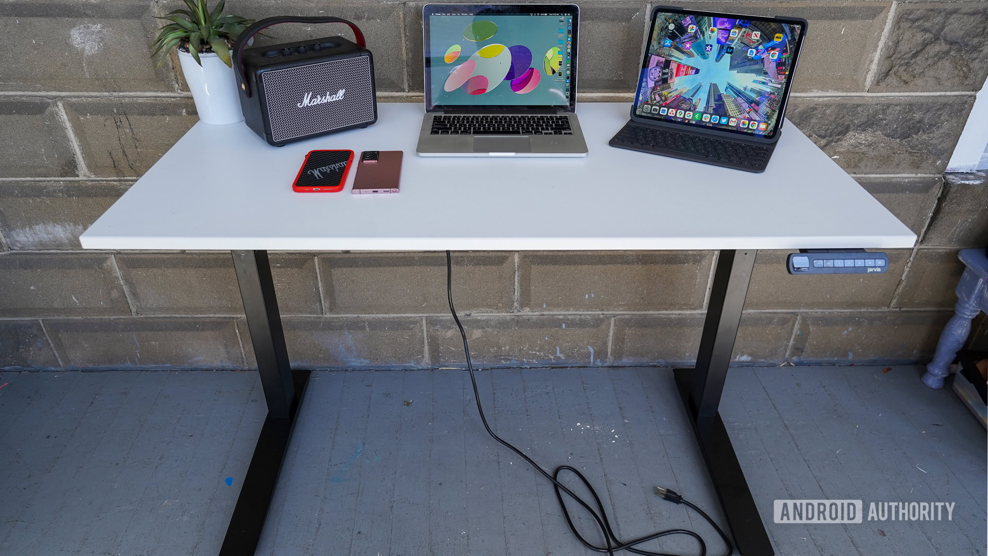 Fully Jarvis standing desk lowere with stuff