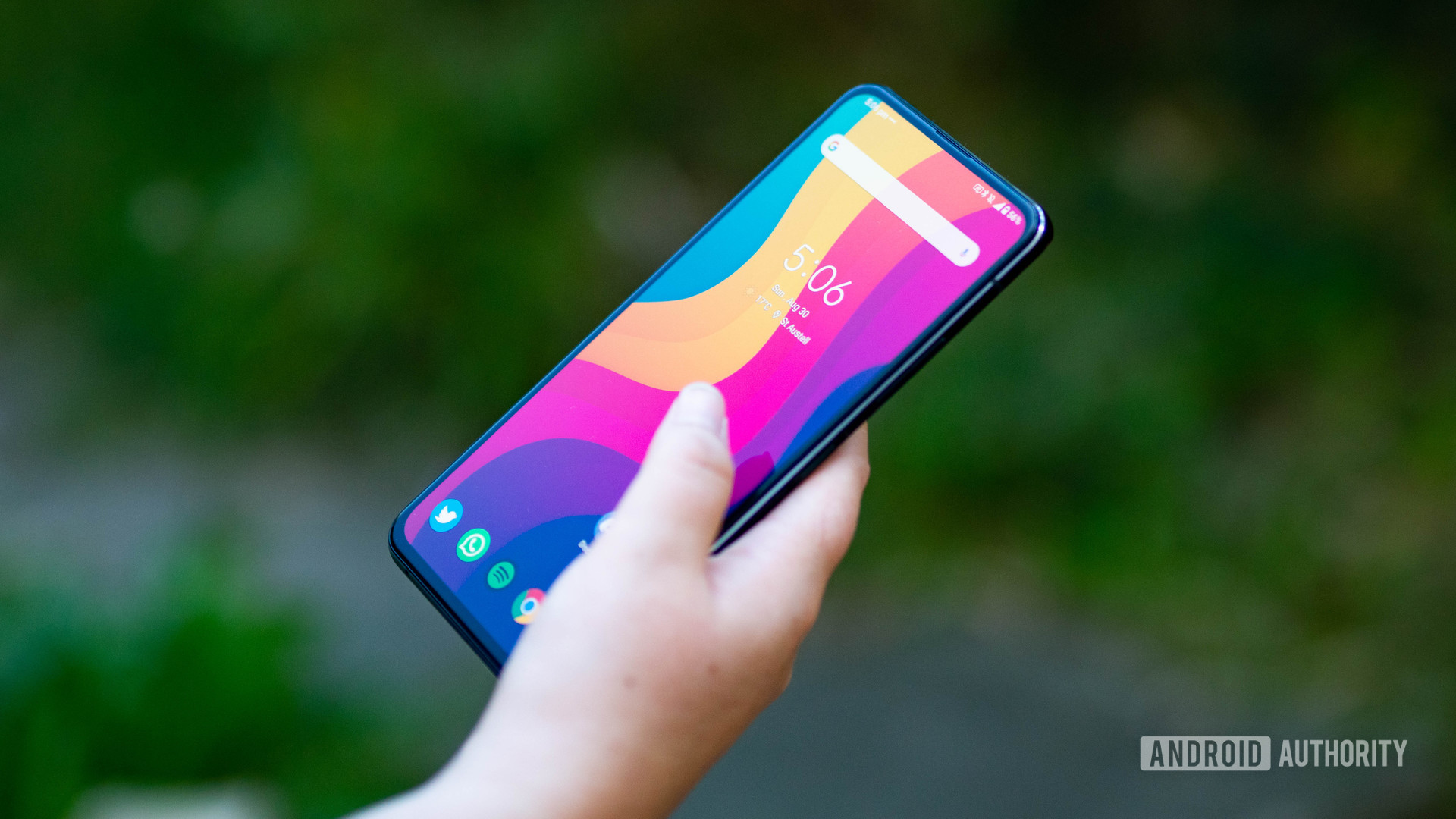 Holding the ASUS Zenfone 7 Pro in the hand at an angle