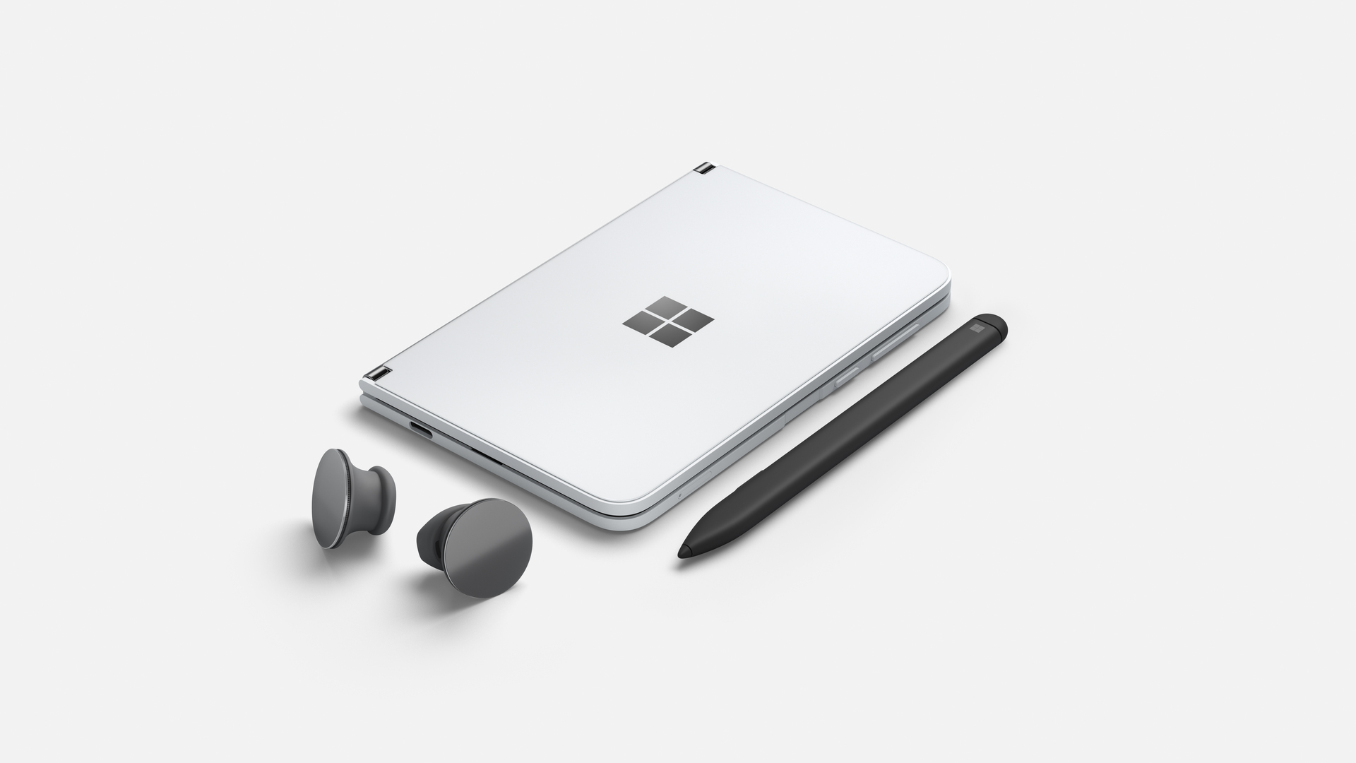 Microsoft Surface Duo closed with Pen and Earbuds