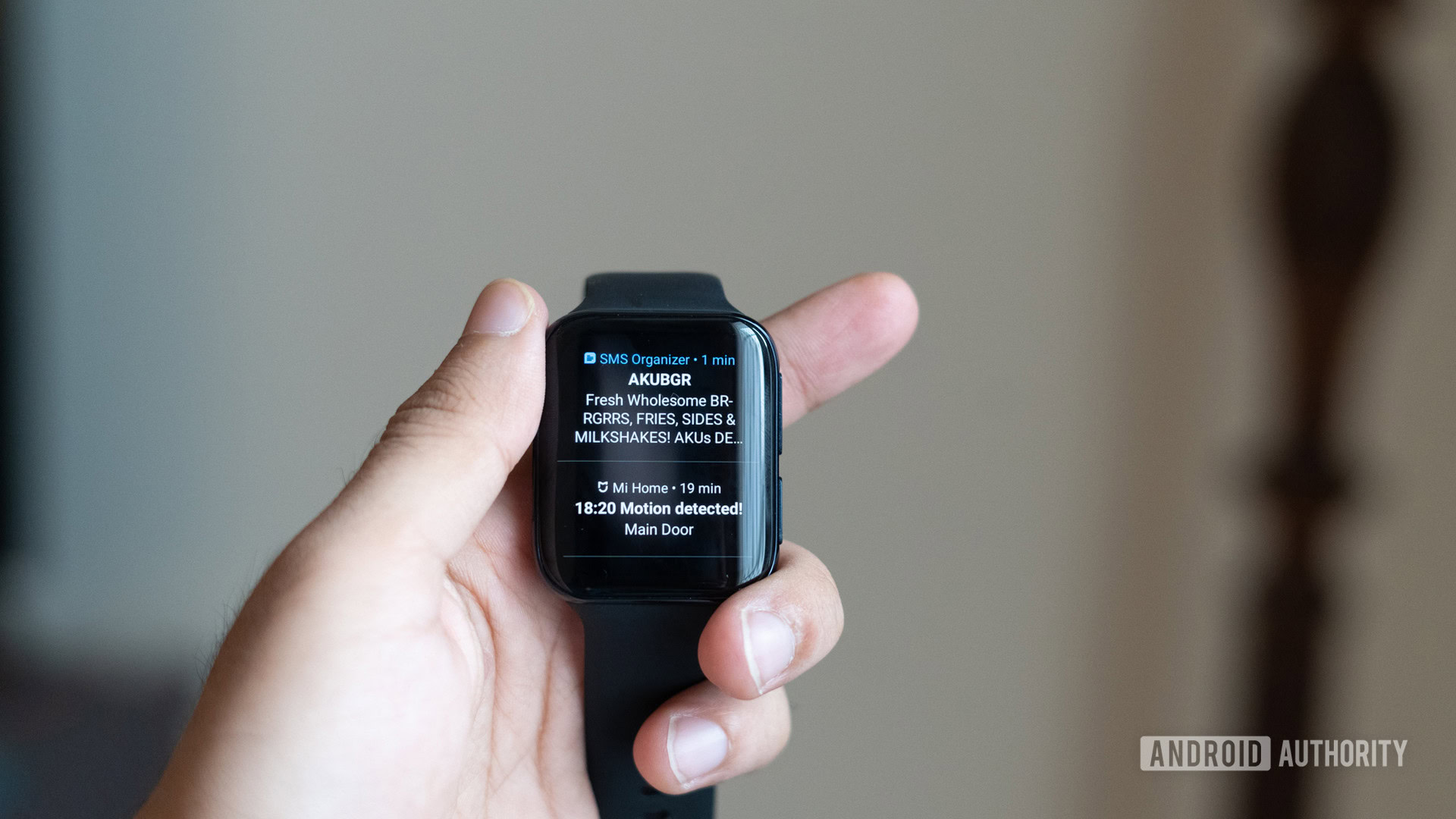 OPPO Watch in hand showing notifications