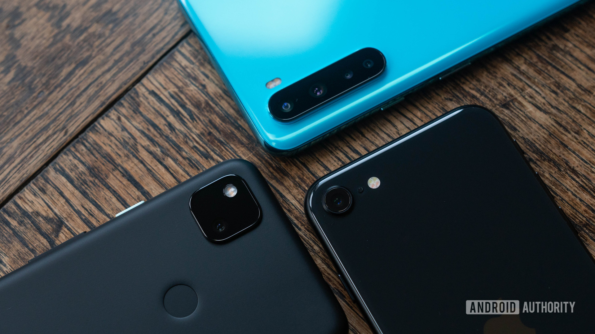 Pixel 4a vs iPhone SE vs OnePlus Nord cameras together top down