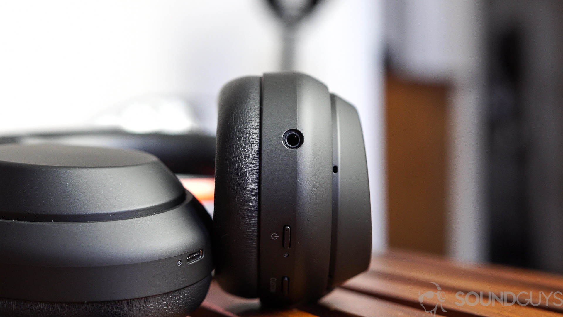 Photo of the Sony WH 1000XM4 noise canceling headphone inputs and buttons on the ear cups.