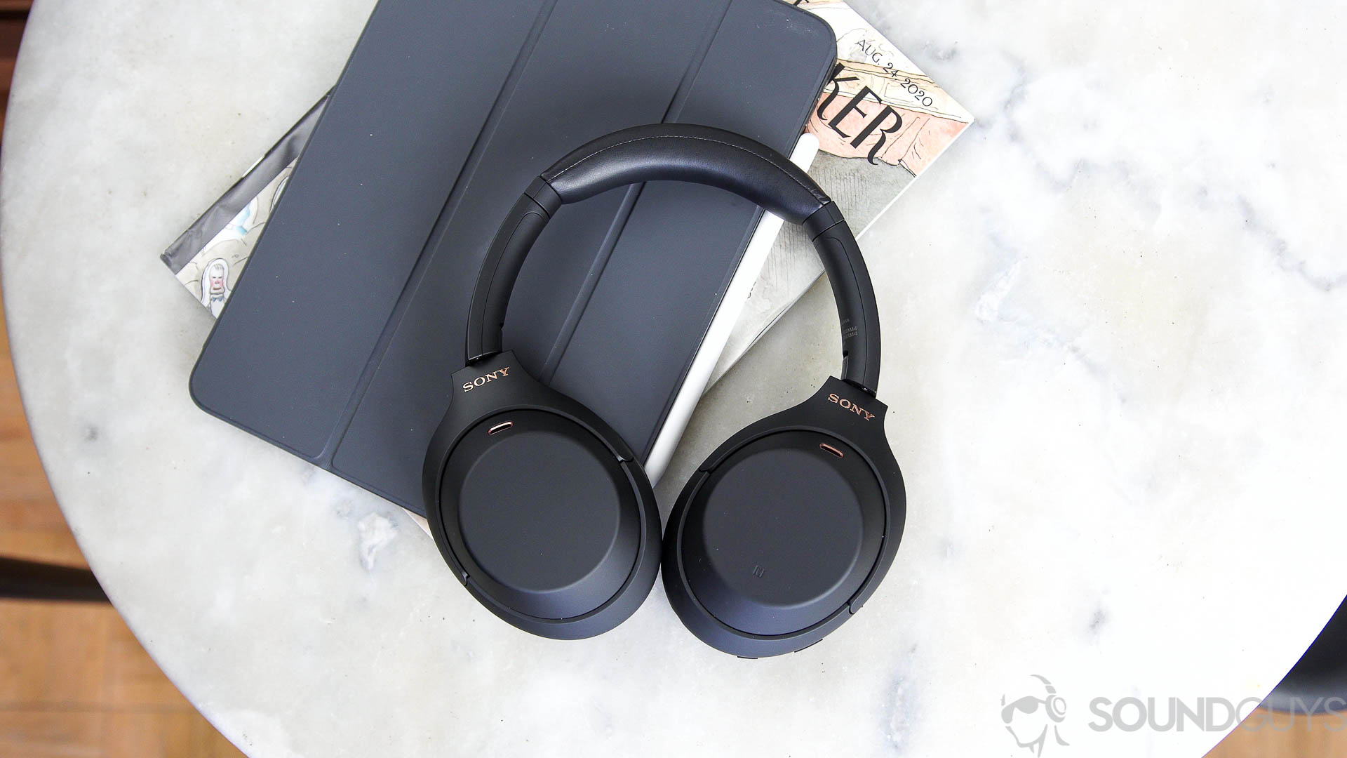 The Sony WH 1000XM4 noise cancelling headphones on top of an ipad.