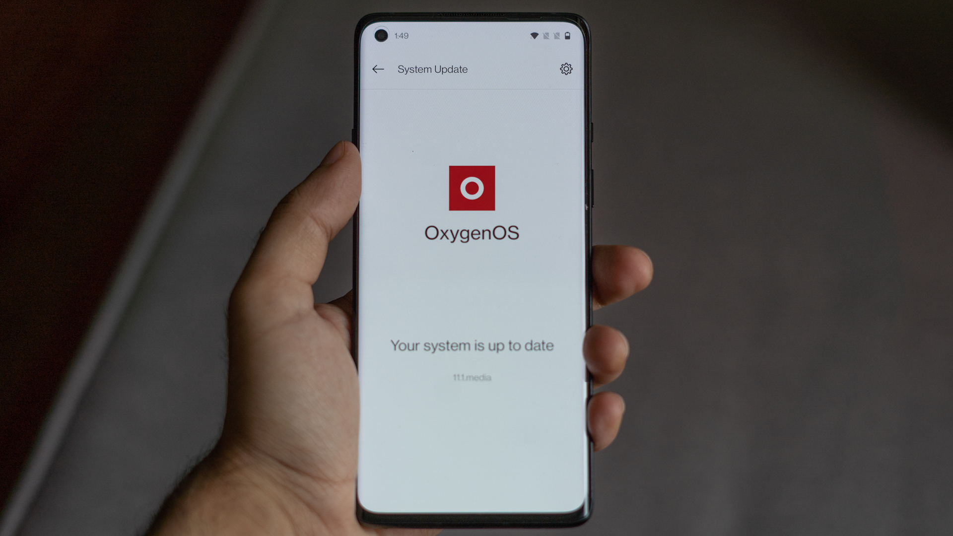 OnePlus Oxygen OS 11 Android 11 on phone in hand.