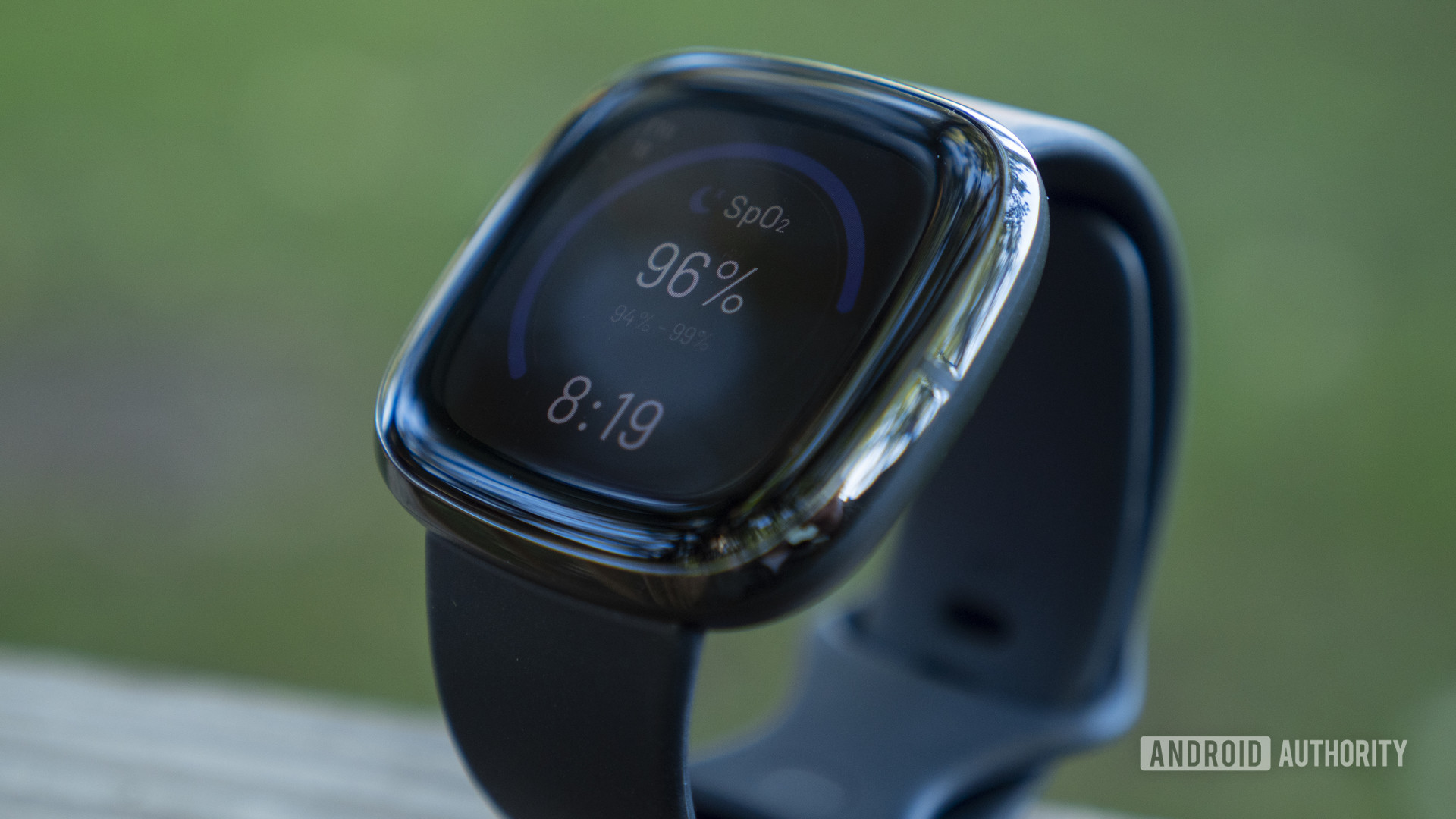 The Fitbit Sense display showing watch face