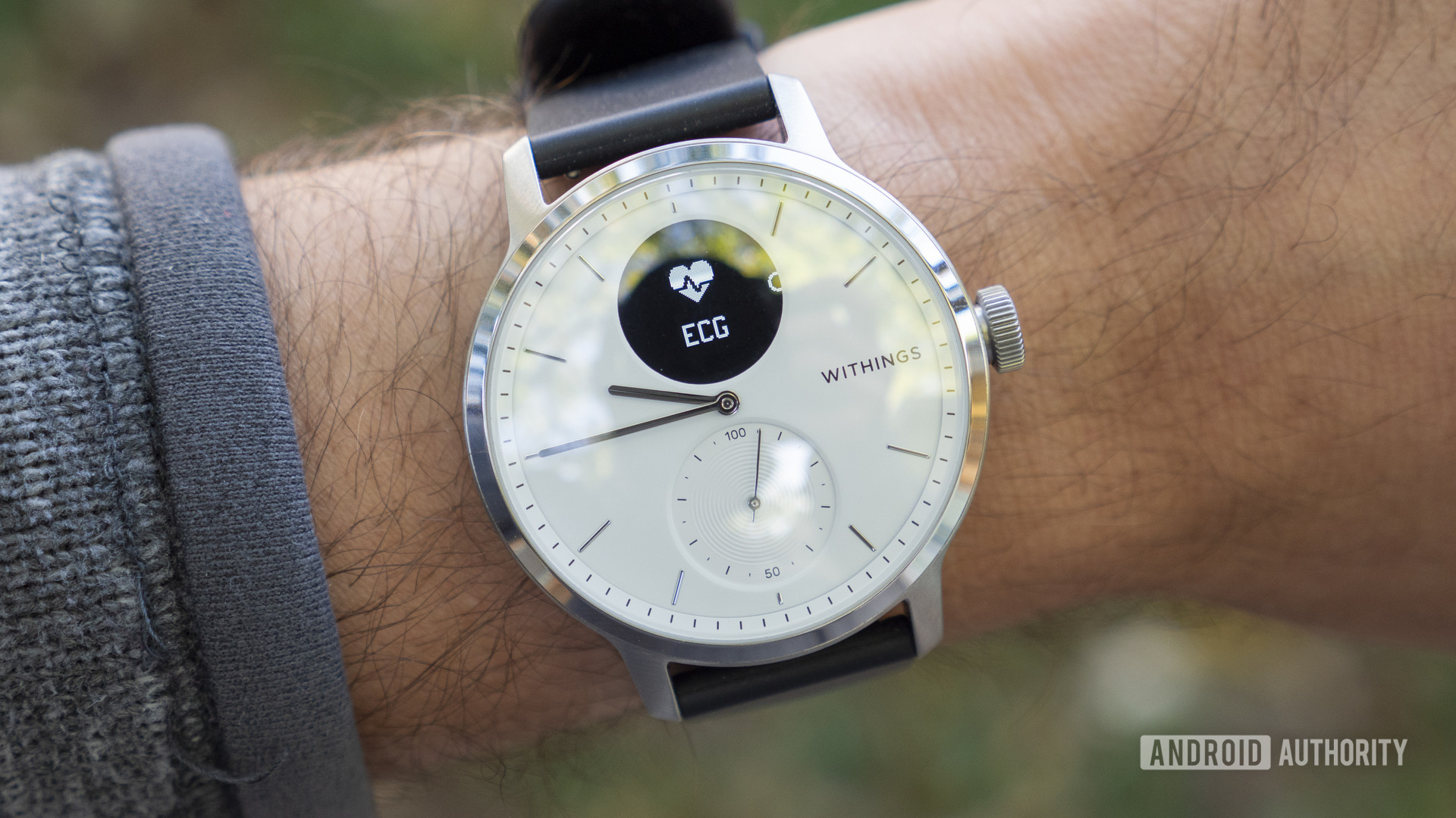 A Withings Scanwatch on a user's wrist displays the ECG app icon.