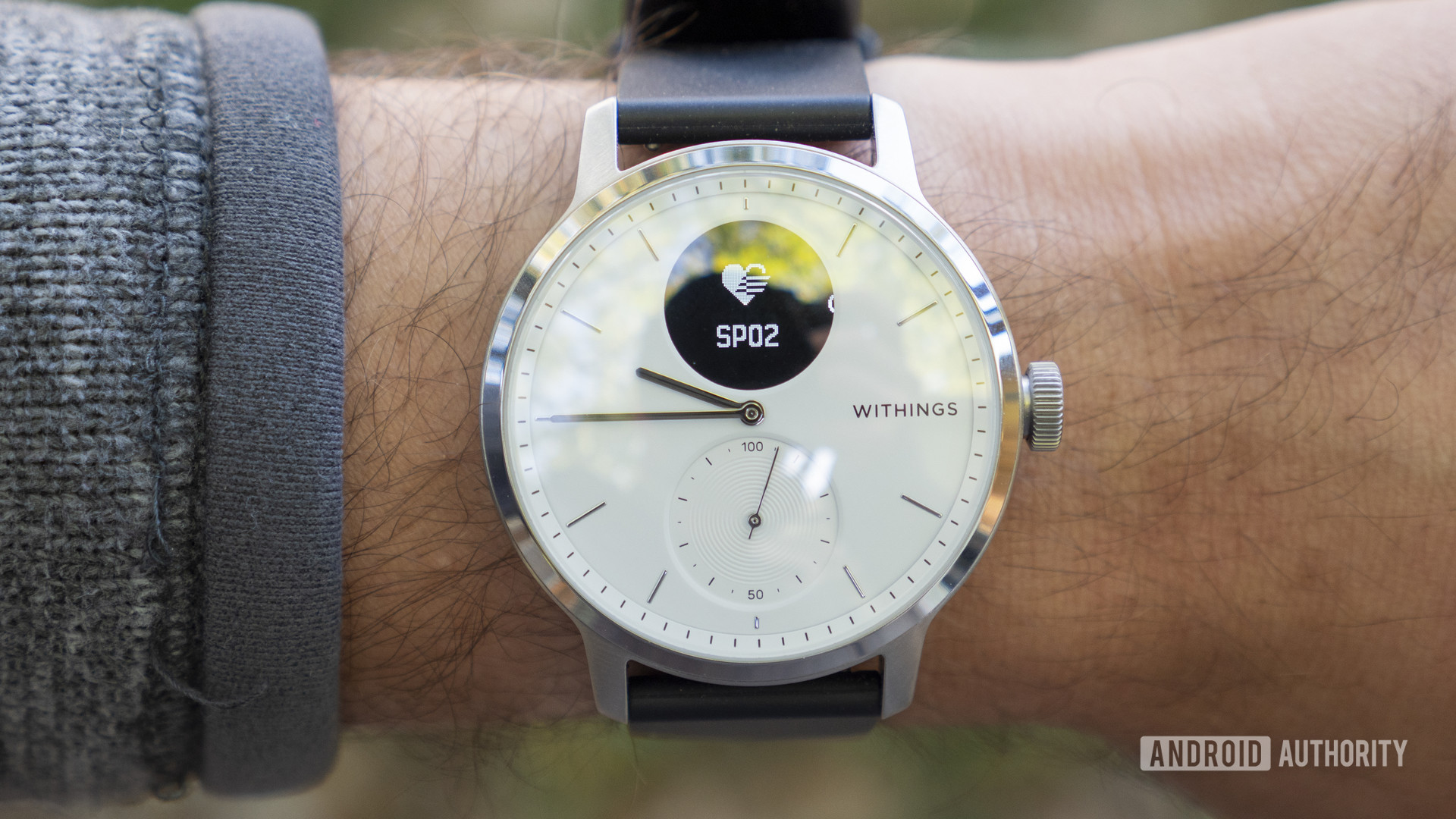 Our pick for best medical-grade sleep tracker watch, the Withings ScanWatch displays the SpO2 icon on a user's wrist.