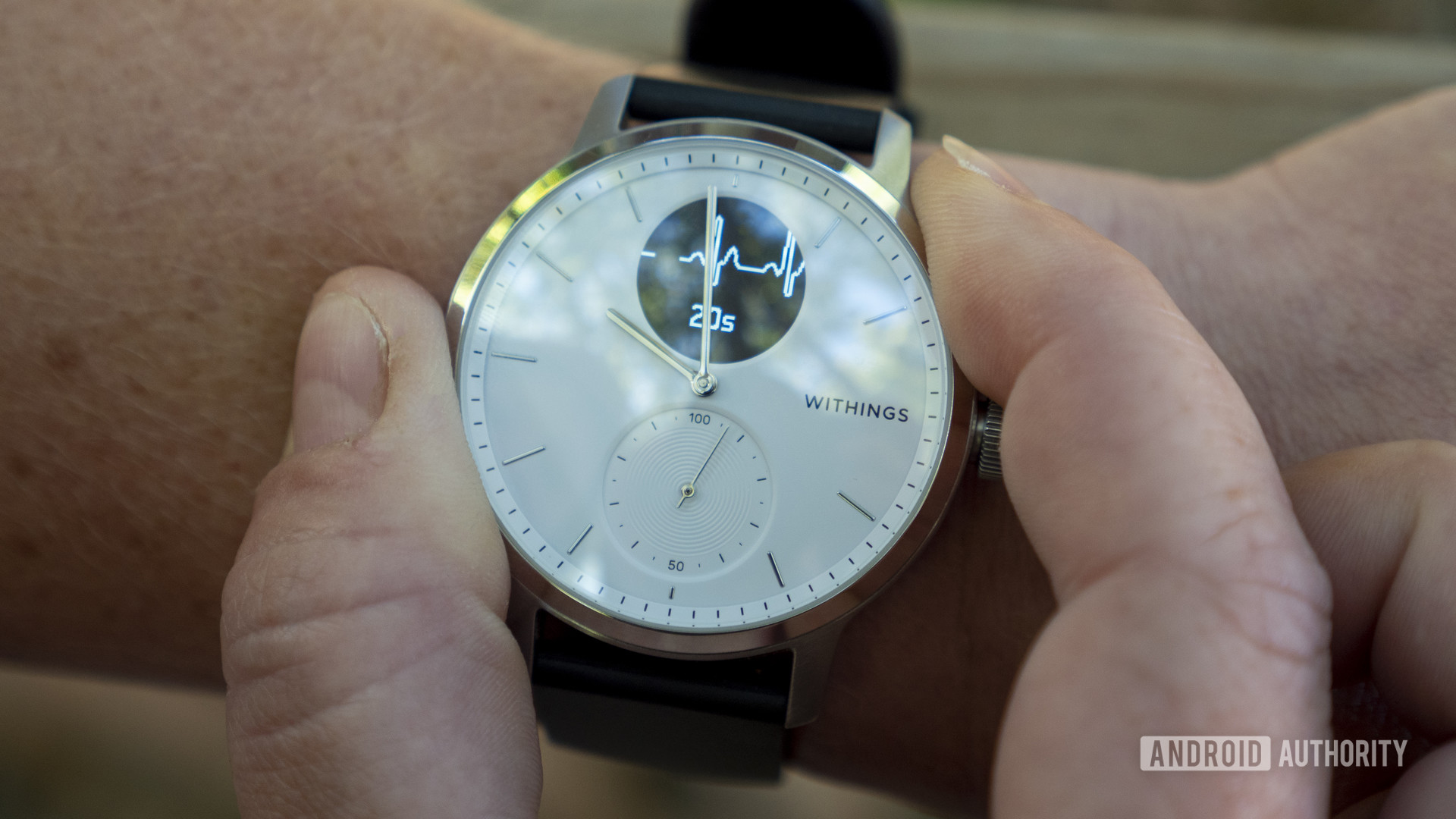 withings scanwatch review taking an ecg recording fingers bezel