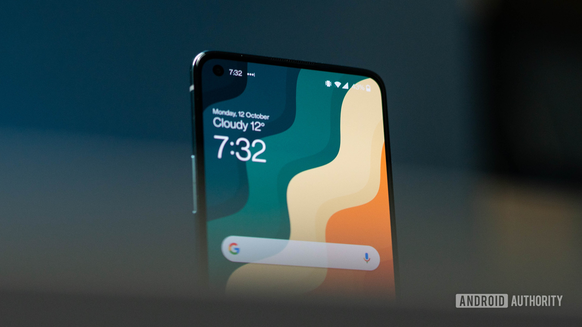 OnePlus 8T angled front hero shot focusing on the top of the display