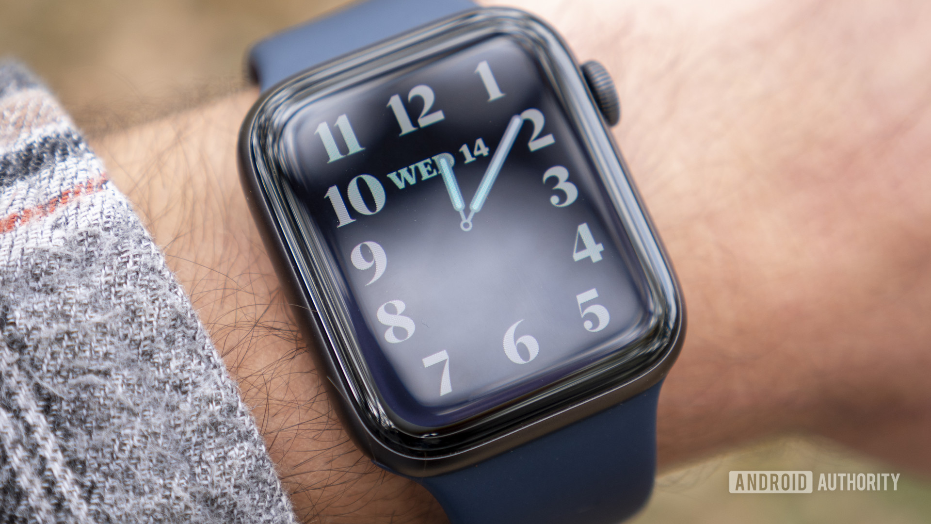 A user displays the time on his Apple Watch Series 6 highlighting the device's always on display on wrist.