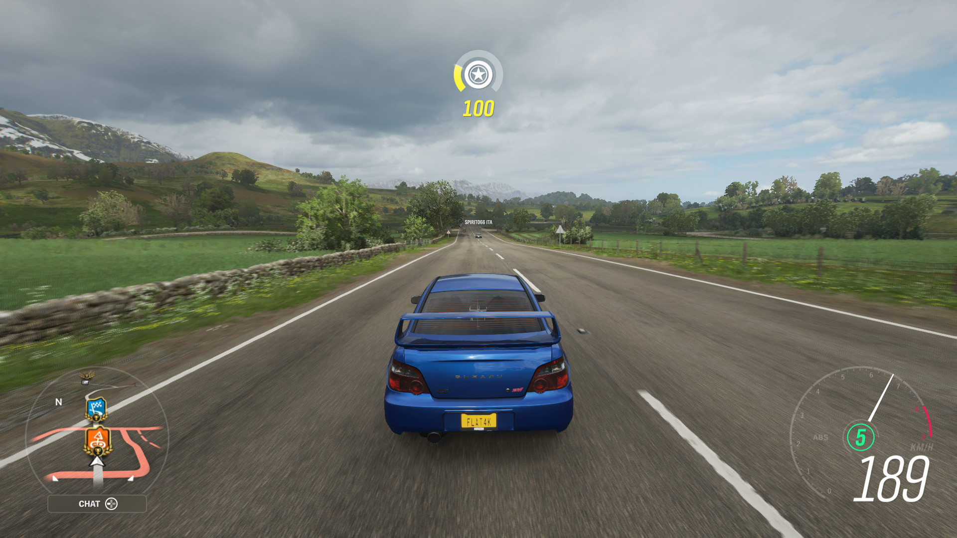 Xbox Series S screenshot of Forza Horizon 4 with a Subaru driving through the countryside