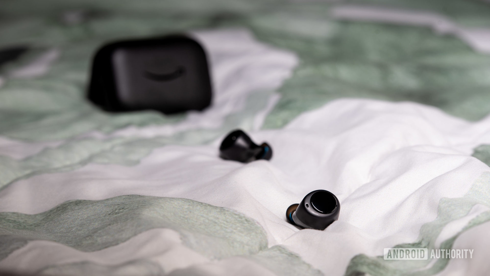 The Amazon Echo Buds true wireless earbuds outside of the case.