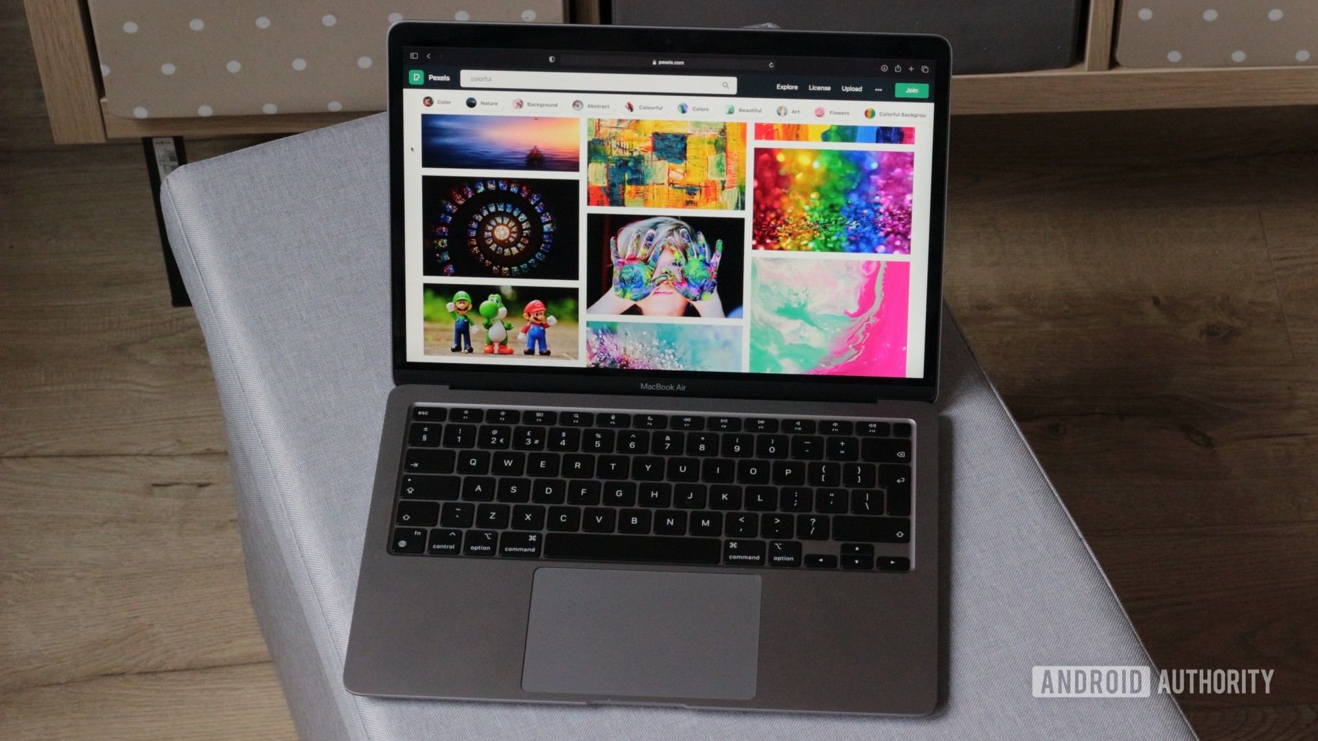Apple MacBook Air M1 open showing colorful photos