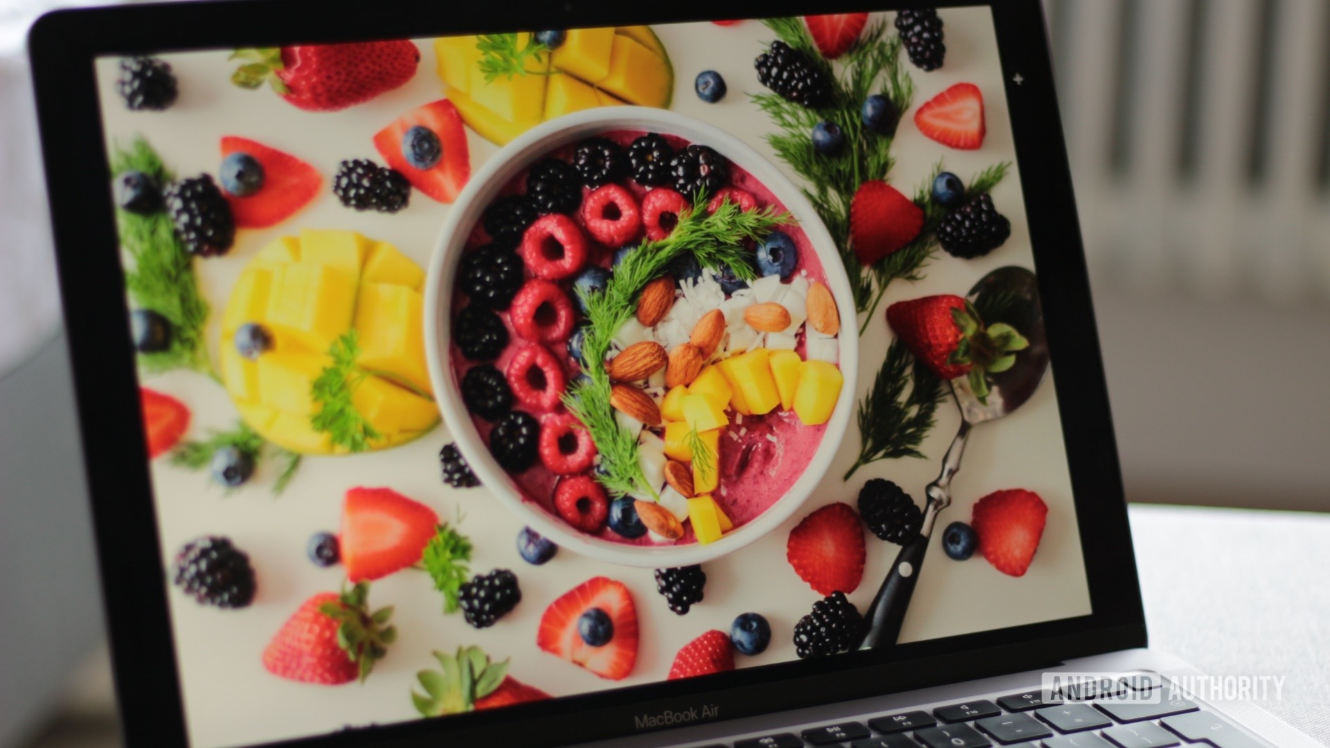 Apple MacBook Air M1 showing photos of fruits