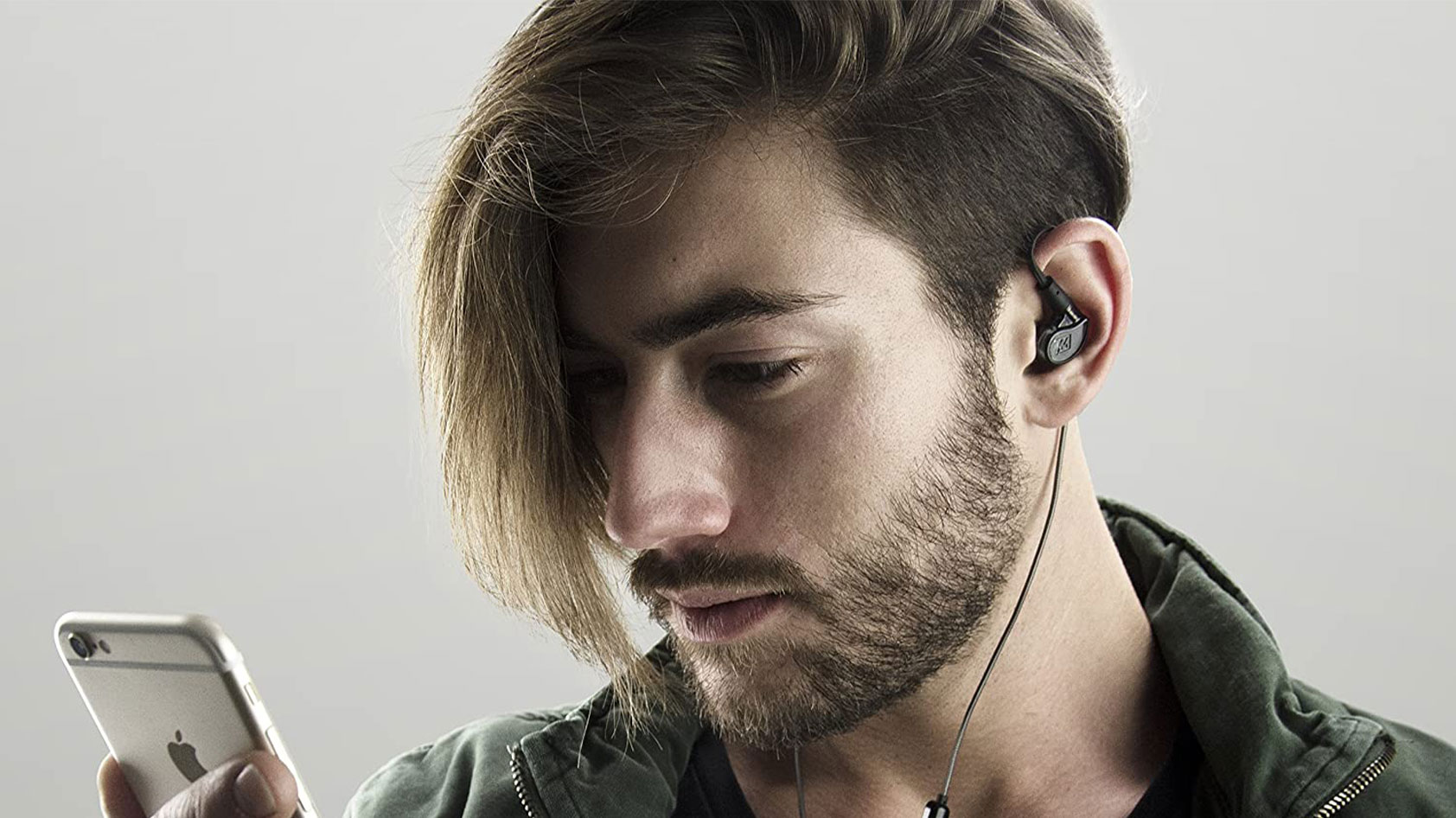 A man wears the MEE audio M6 PRO wired IEMs.