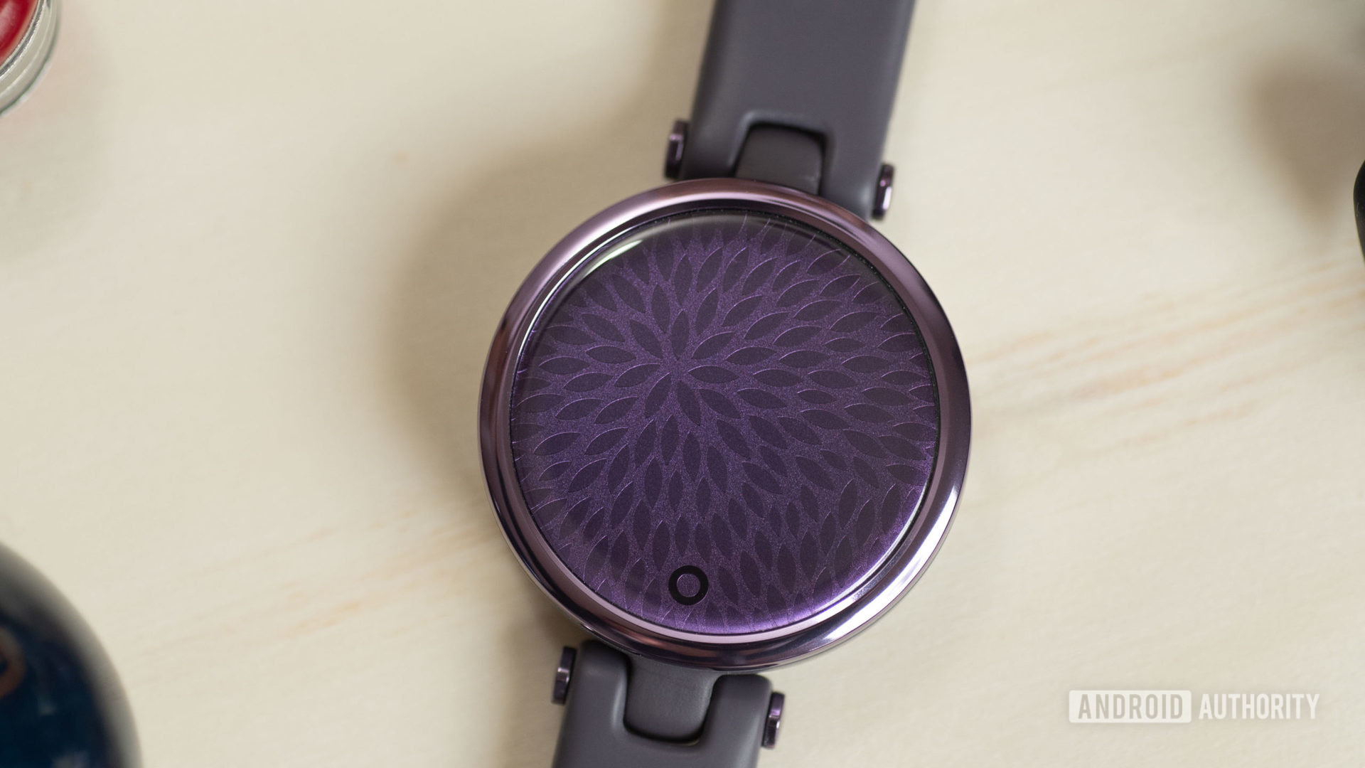 The blank face of the Garmin Lily Sport Edition smart watch in purple.
