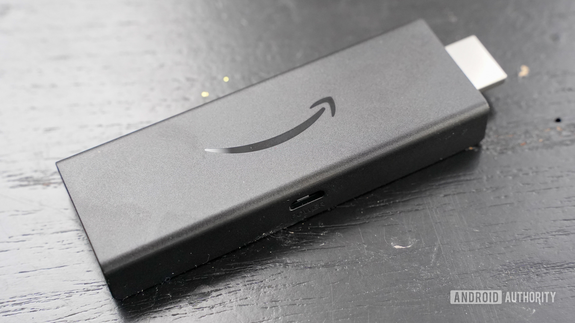 Amazon Fire TV Stick Lite angled by itself