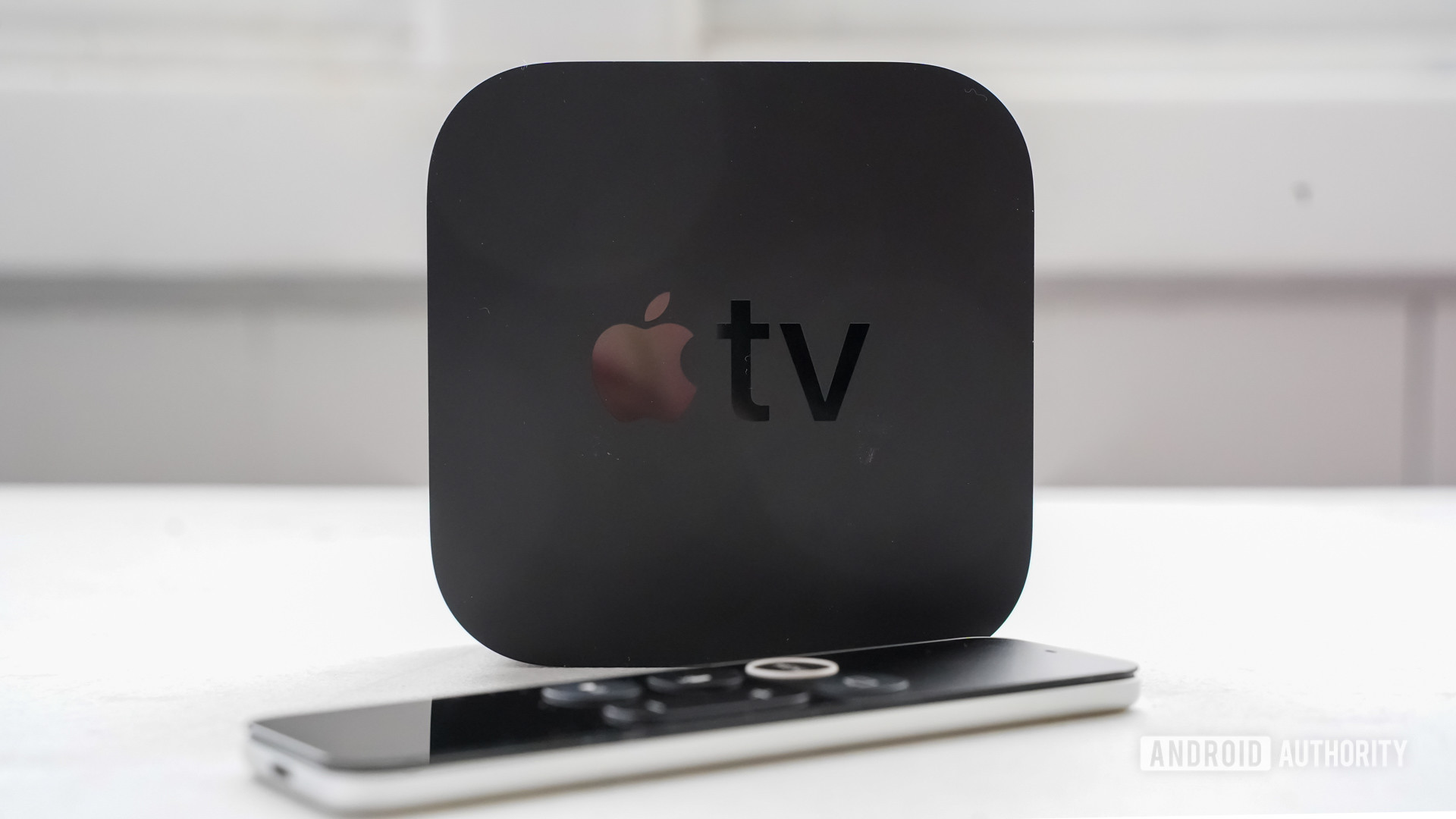 Apple TV 4K standing with remote